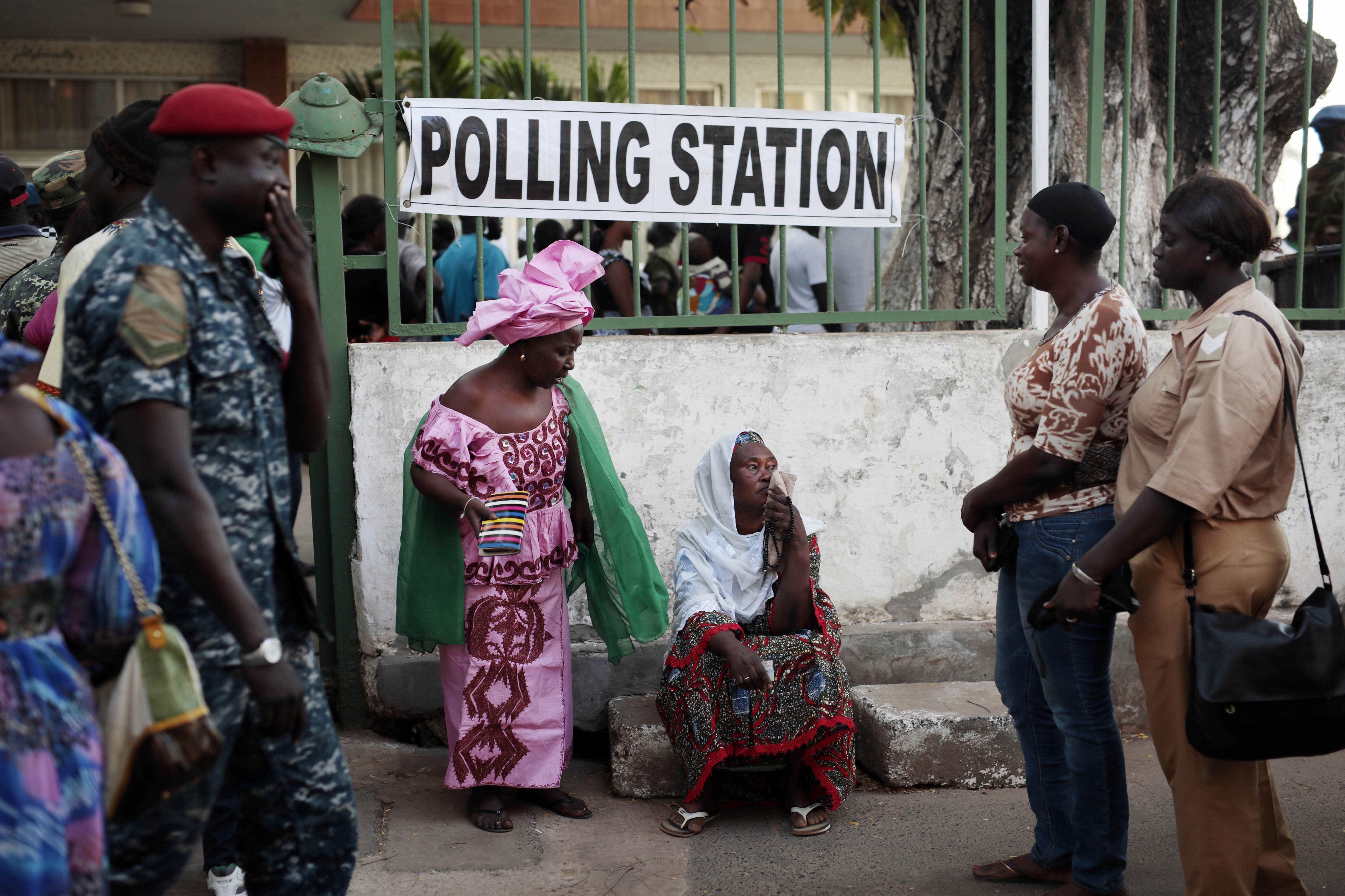 Gambians wait to cast their vote at a polling station in Banjul, Gambia, on 1 December 2016, AP Photo/Jerome Delay