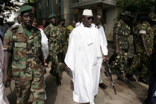 Gambian President Yahya Jammeh, centre, leaves a central Banjul polling station after casting his vote for president, on 22 September 2006, AP Photo/Rebecca Blackwell, FILE