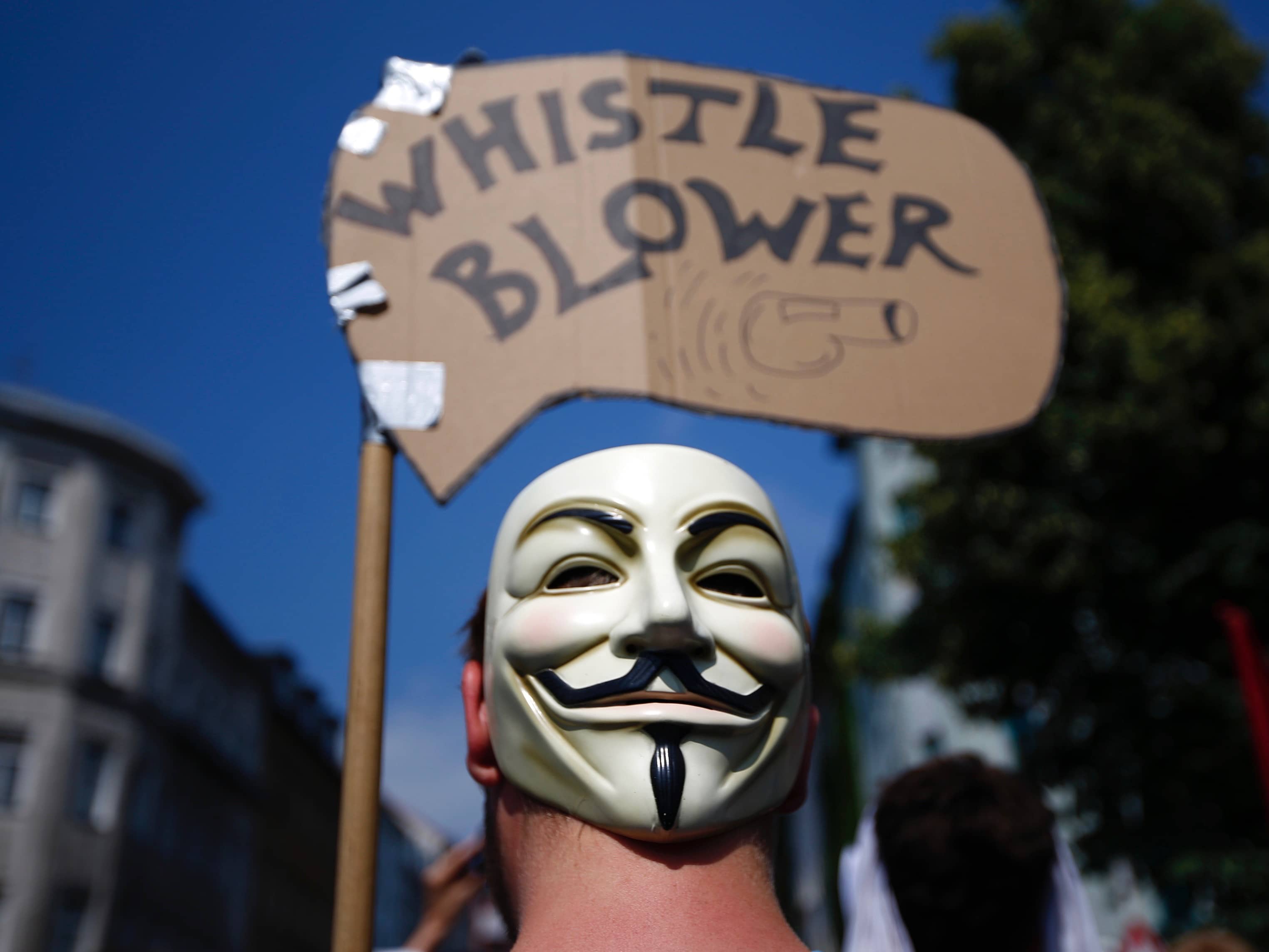 A protester wearing a Guy Fawkes mask attends a demonstration in solidarity with whistleblowers in Berlin, 27 July 2013, REUTERS/Pawel Kopczynski