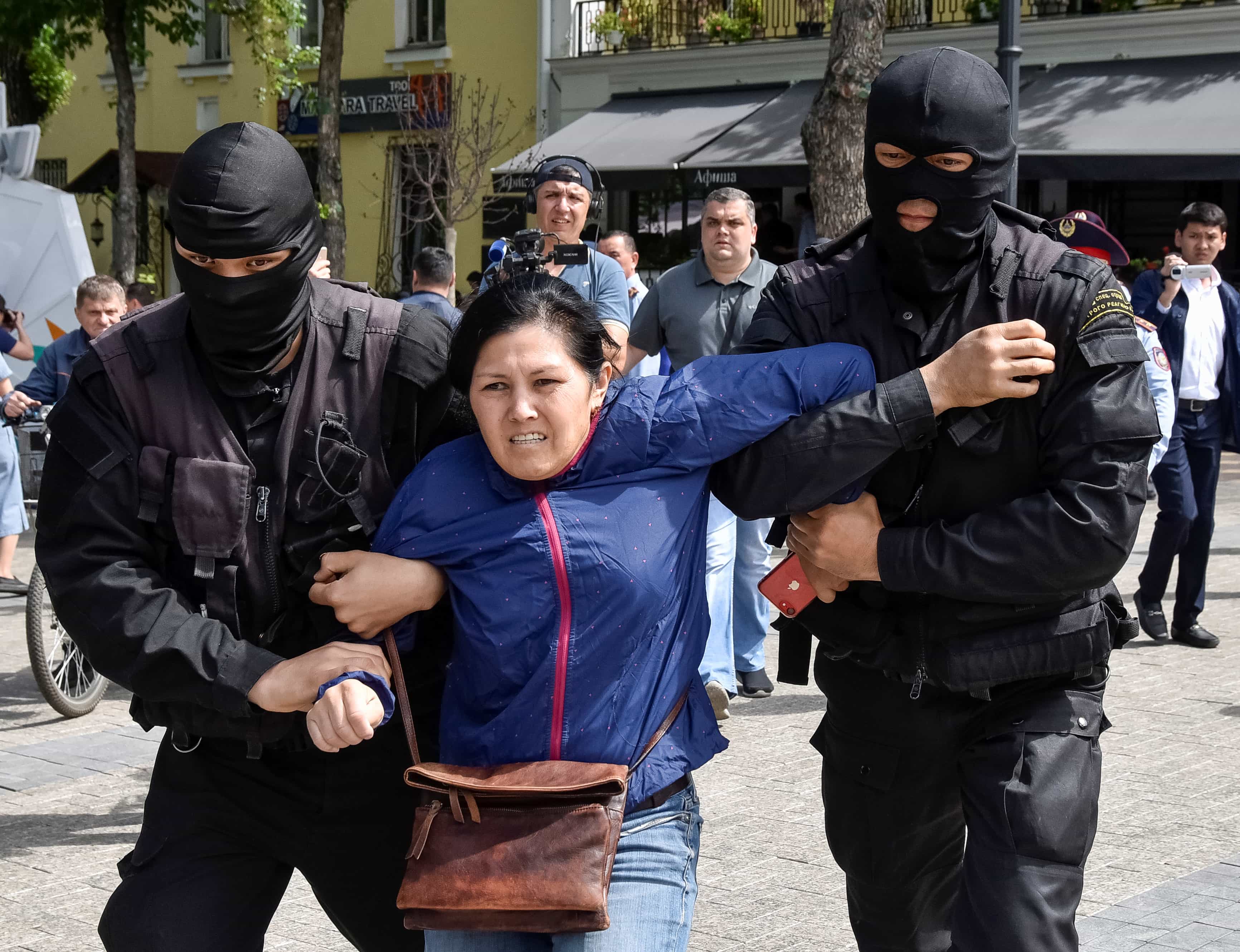 Policemen detain an opposition supporter during a protest rally in Almaty, Kazakhstan May 10, 2018. , REUTERS/Mariya Gordeyeva