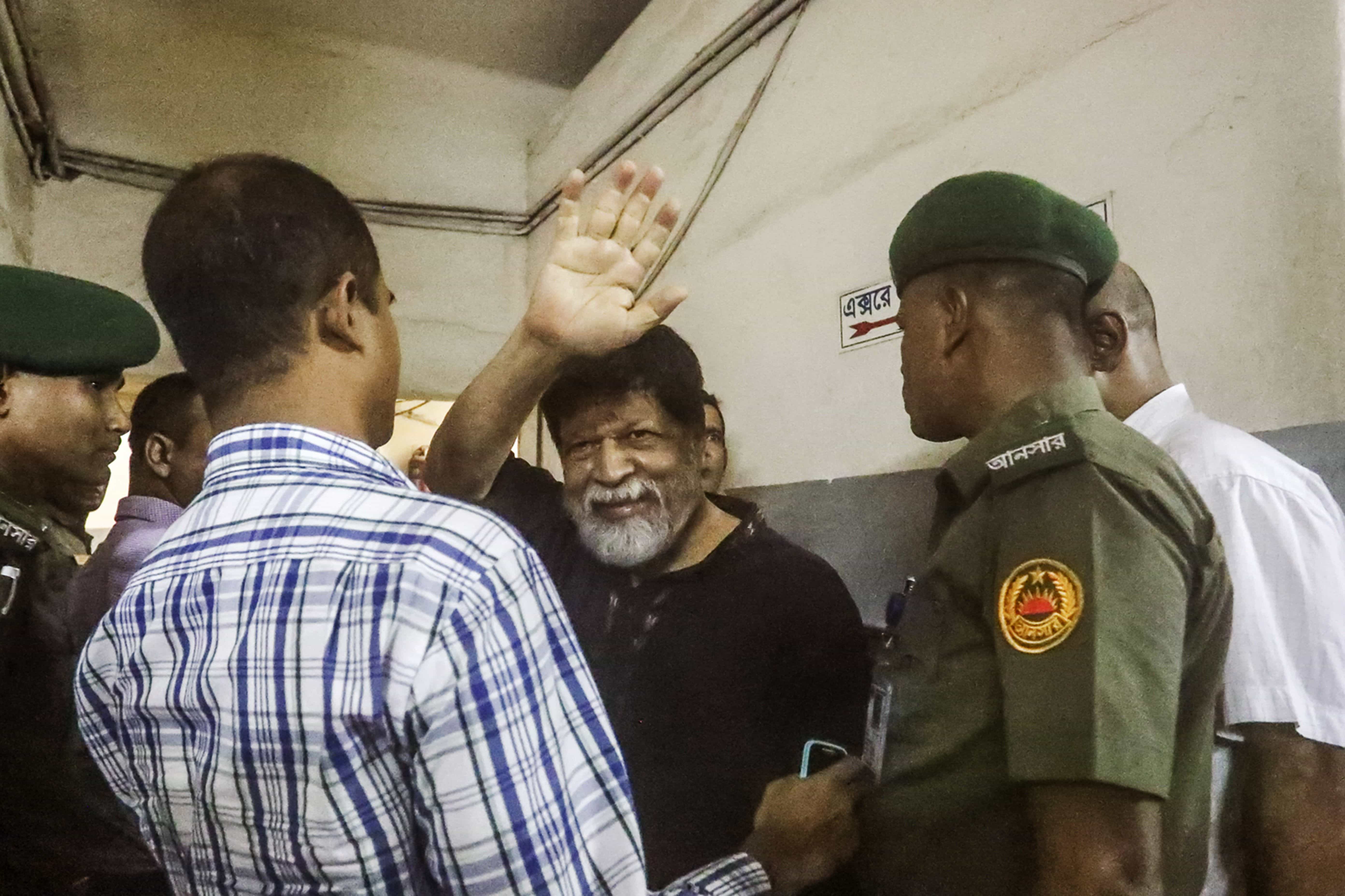 Renowned Bangladeshi photographer Shahidul Alam, 63, gestures in a hospital in Dhaka, 8 August 2018, -/AFP/Getty Images