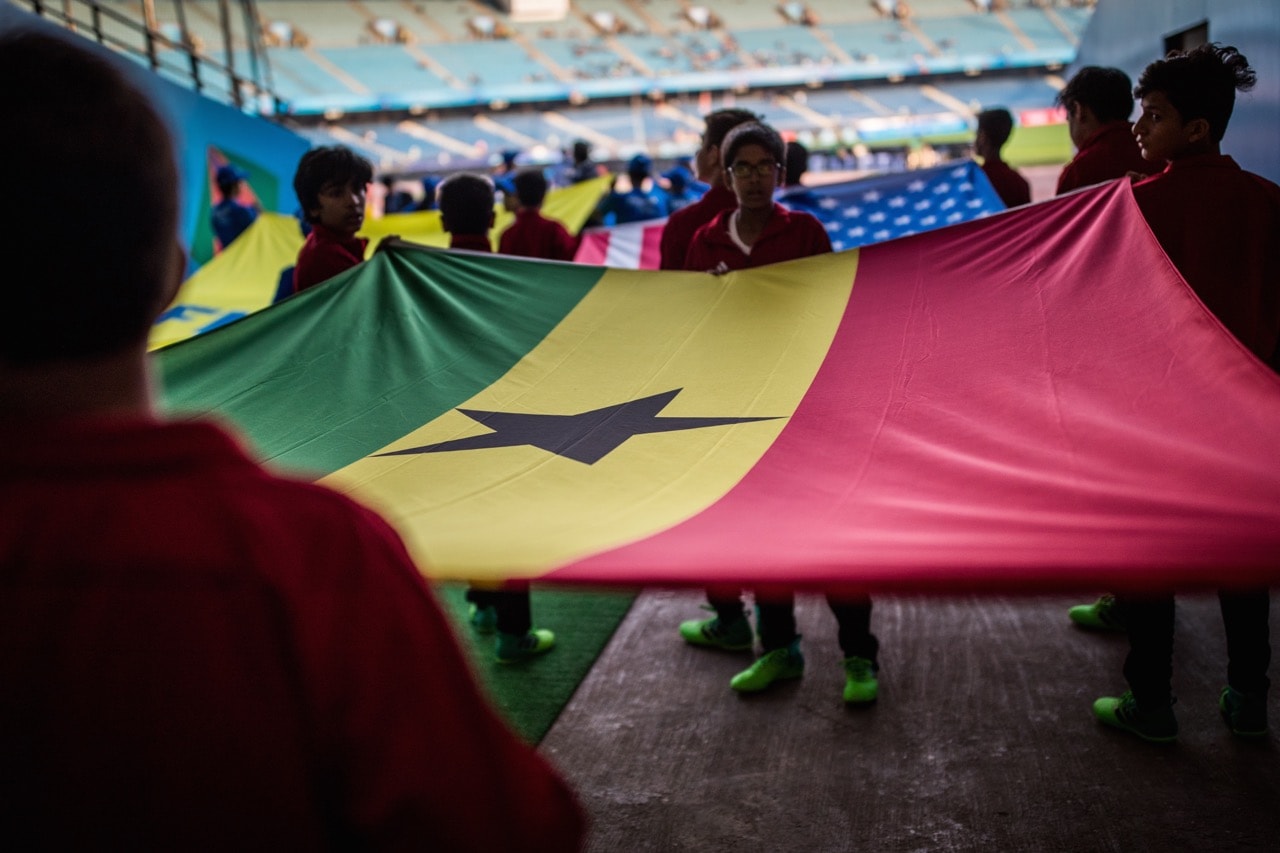 Children hold a Ghana flag prior to a FIFA U-17 World Cup India 2017 match between Ghana and USA in New Delhi, India, 9 October 2017, Maja Hitij - FIFA/FIFA via Getty Images