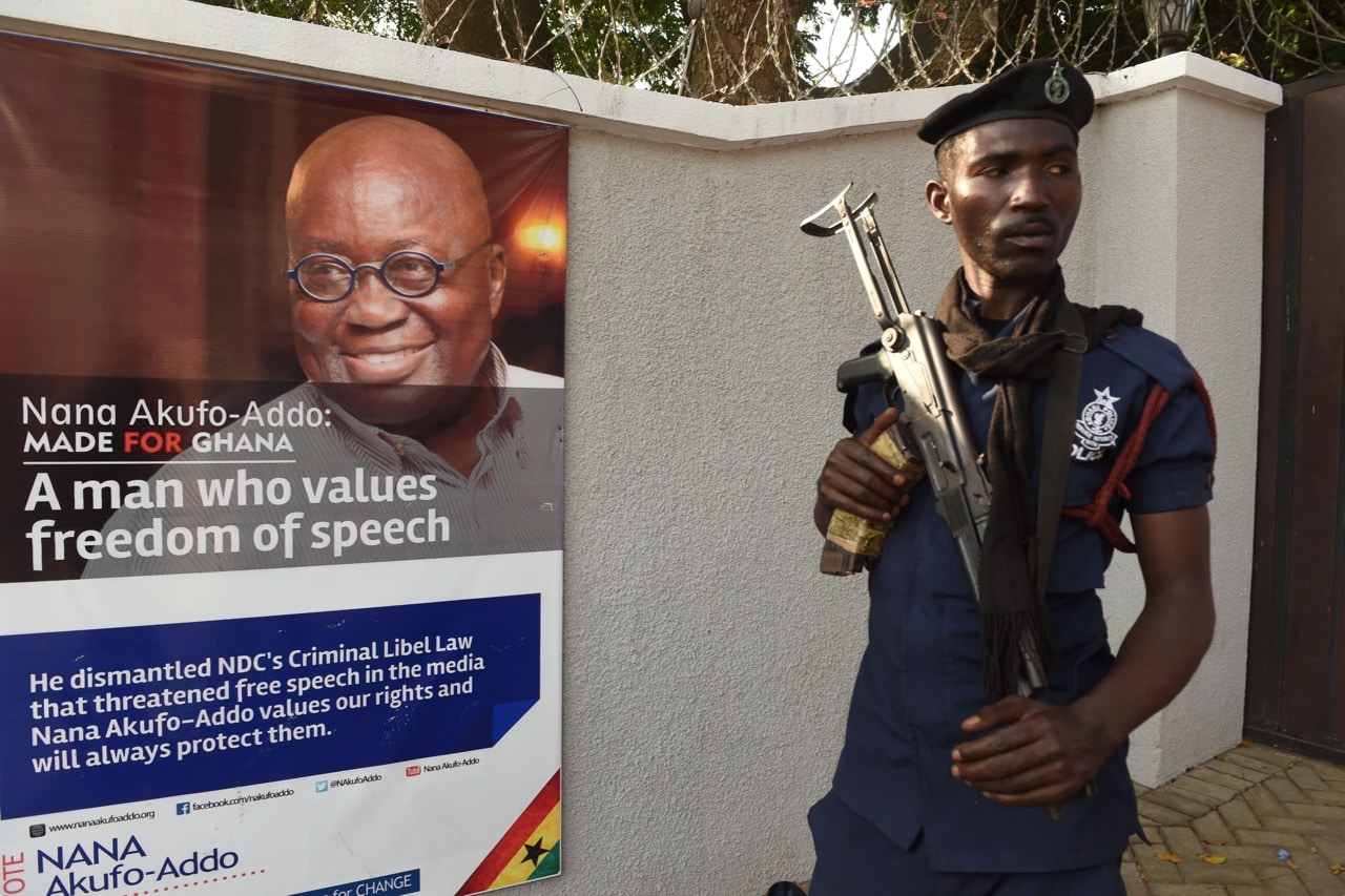 A policeman stands guard at the main gate to the residence of then presidential candidate of the New Patriotic Party Nana Akufo-Addo, in Accra, 9 December 2016, PIUS UTOMI EKPEI/AFP/Getty Images