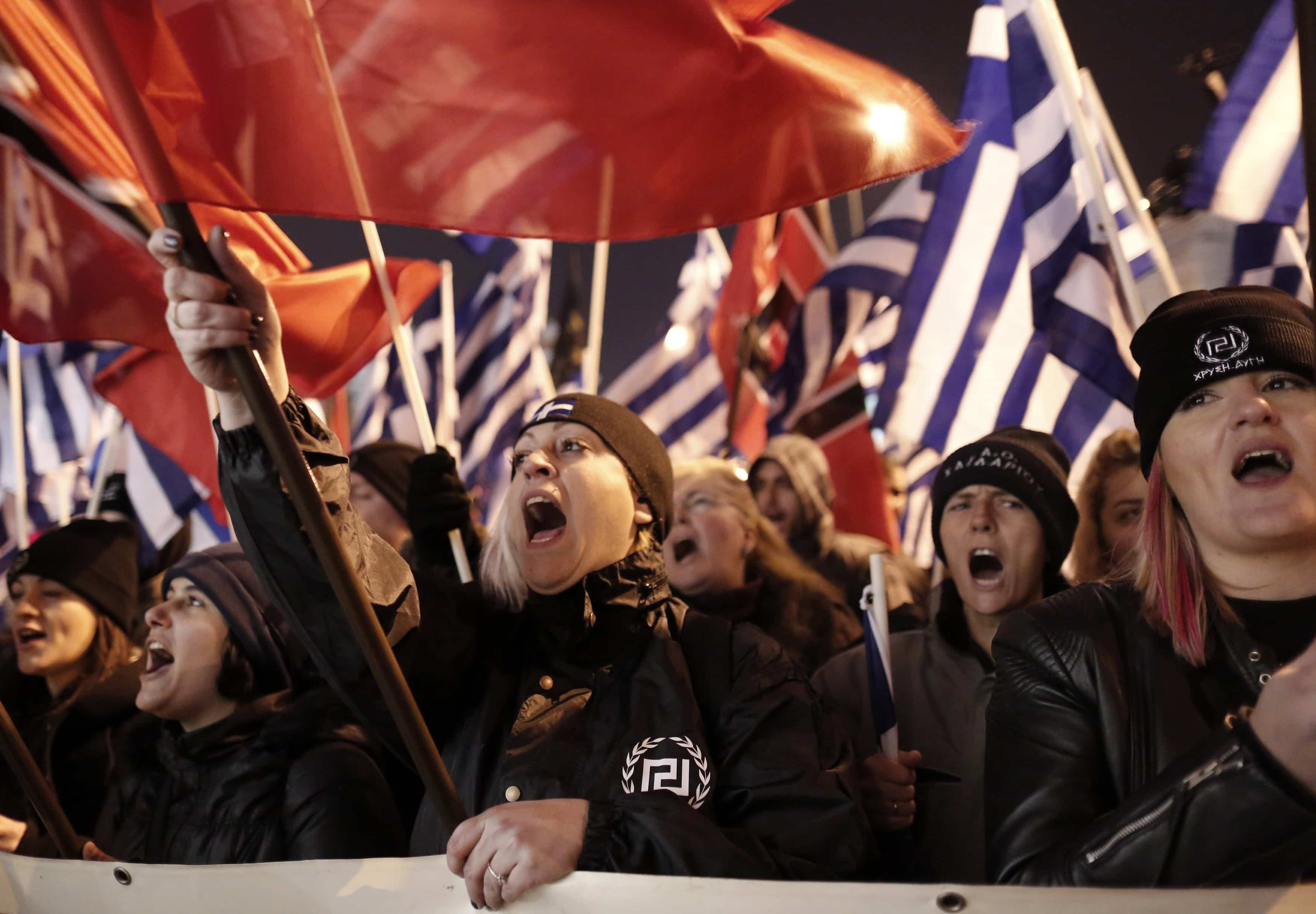 Supporters of Greece's extreme right party Golden Dawn shout slogans during a rally in Athens, 1 February 2014., AP Photo/Yannis Kolesidis