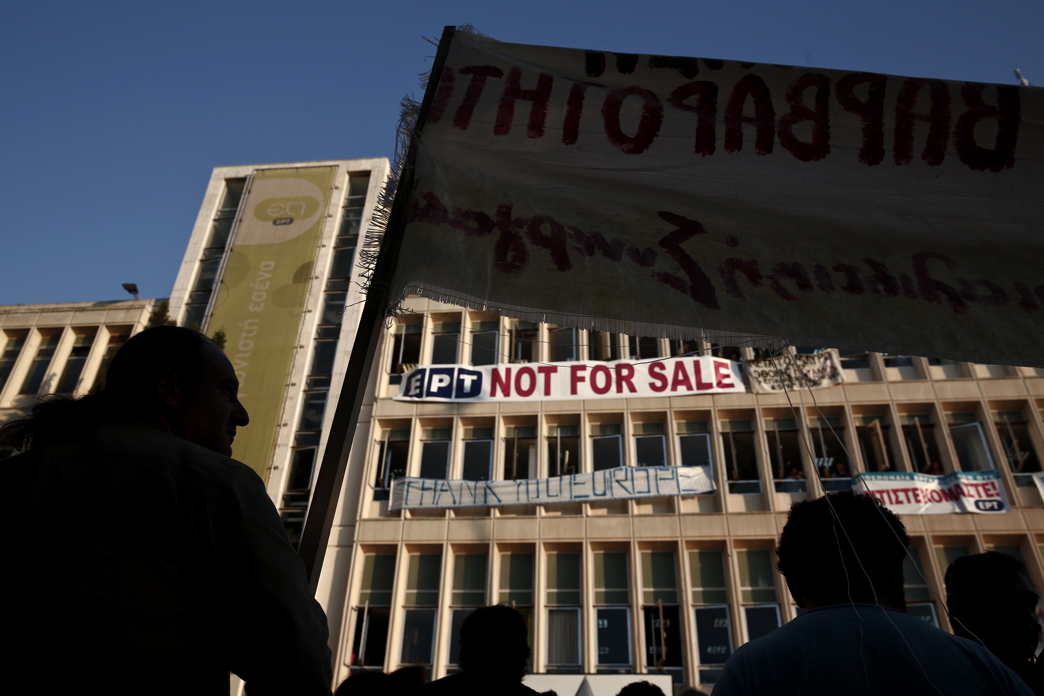 Protesters gather in front of former Greek state broadcaster ERT headquarters in the northern suburb of Agia Paraskevi in Athens. 14 June 2013. , REUTERS/Yorgos Karahalis