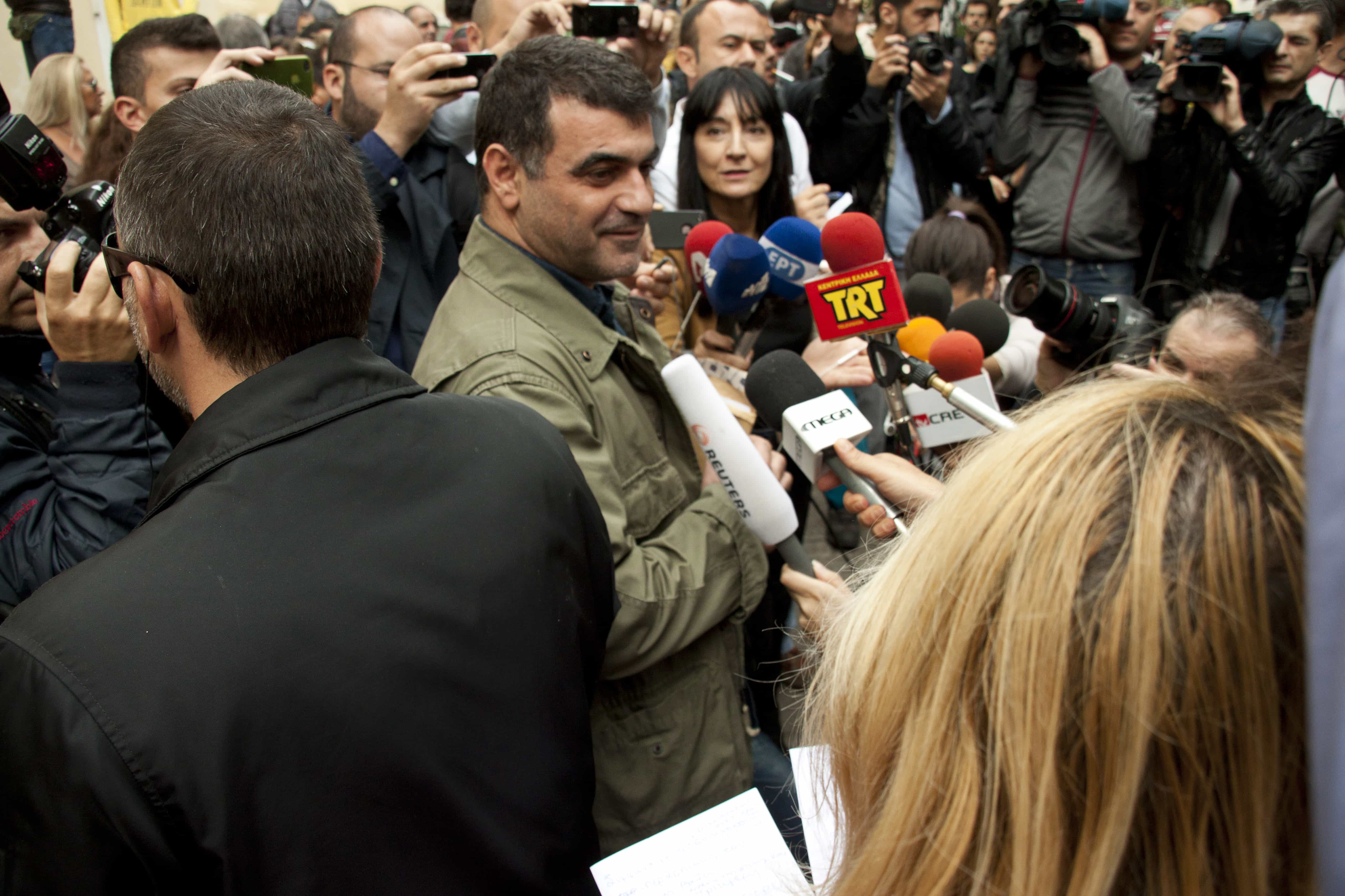 Investigative journalist Kostas Vaxevanis talks to the press after being released from police custody, Demotix