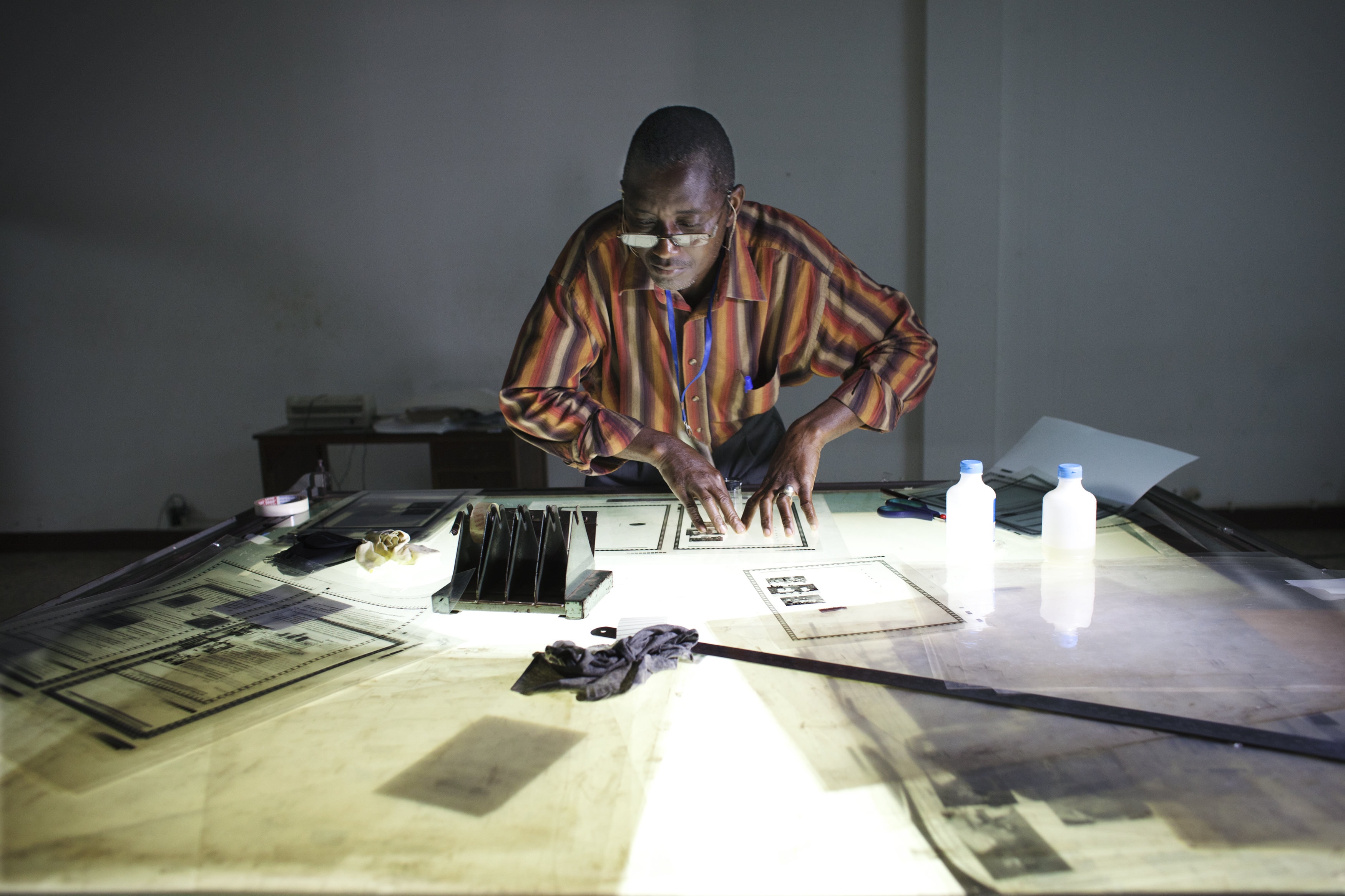A man puts  together Guinea-Bissau's state newspaper at a printing press in the capital Bissau, 30 October 2012, REUTERS/Joe Penney