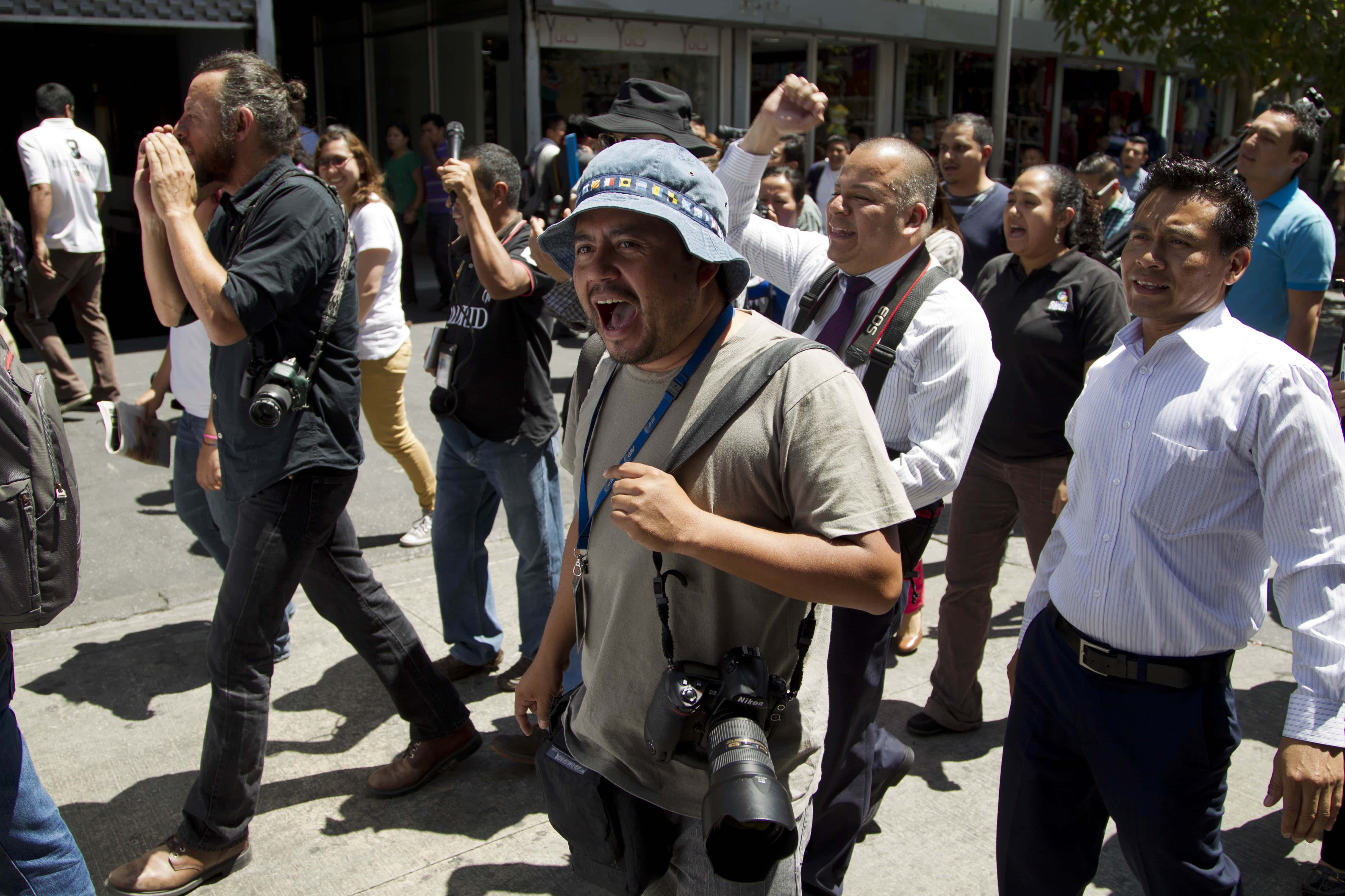 Journalist shout slogans demanding an investigation into the killing of two journalists and increased security for the profession during a march in Guatemala City, 11 March 2015, AP Photo/Moises Castillo