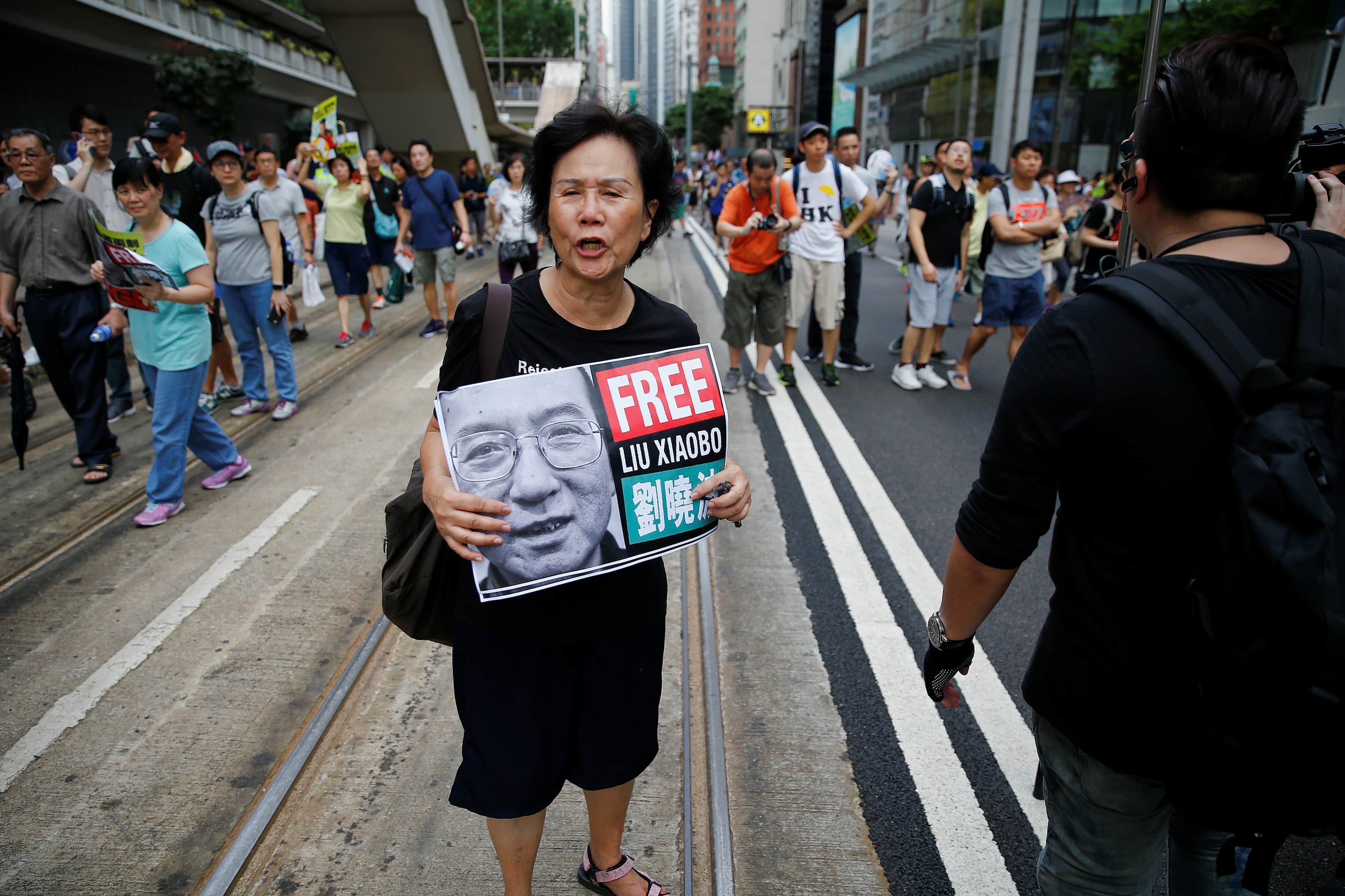 An activist holds a placard demanding the release of Chinese Nobel Peace Laureate Liu Xiaobo during a demonstration on the 20th anniversary of the territory's handover from Britain to Chinese rule, in Hong Kong, 1 July 2017, REUTERS/Damir Sagolj