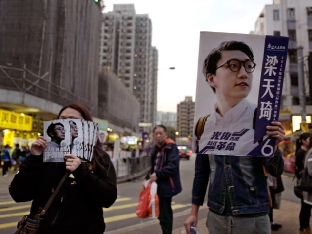 In the lead up to Legislative Council elections in Hong Kong, supporters of candidate Edward Leung take part in an election rally, 28 February 2016, AP Photo/Vincent Yu