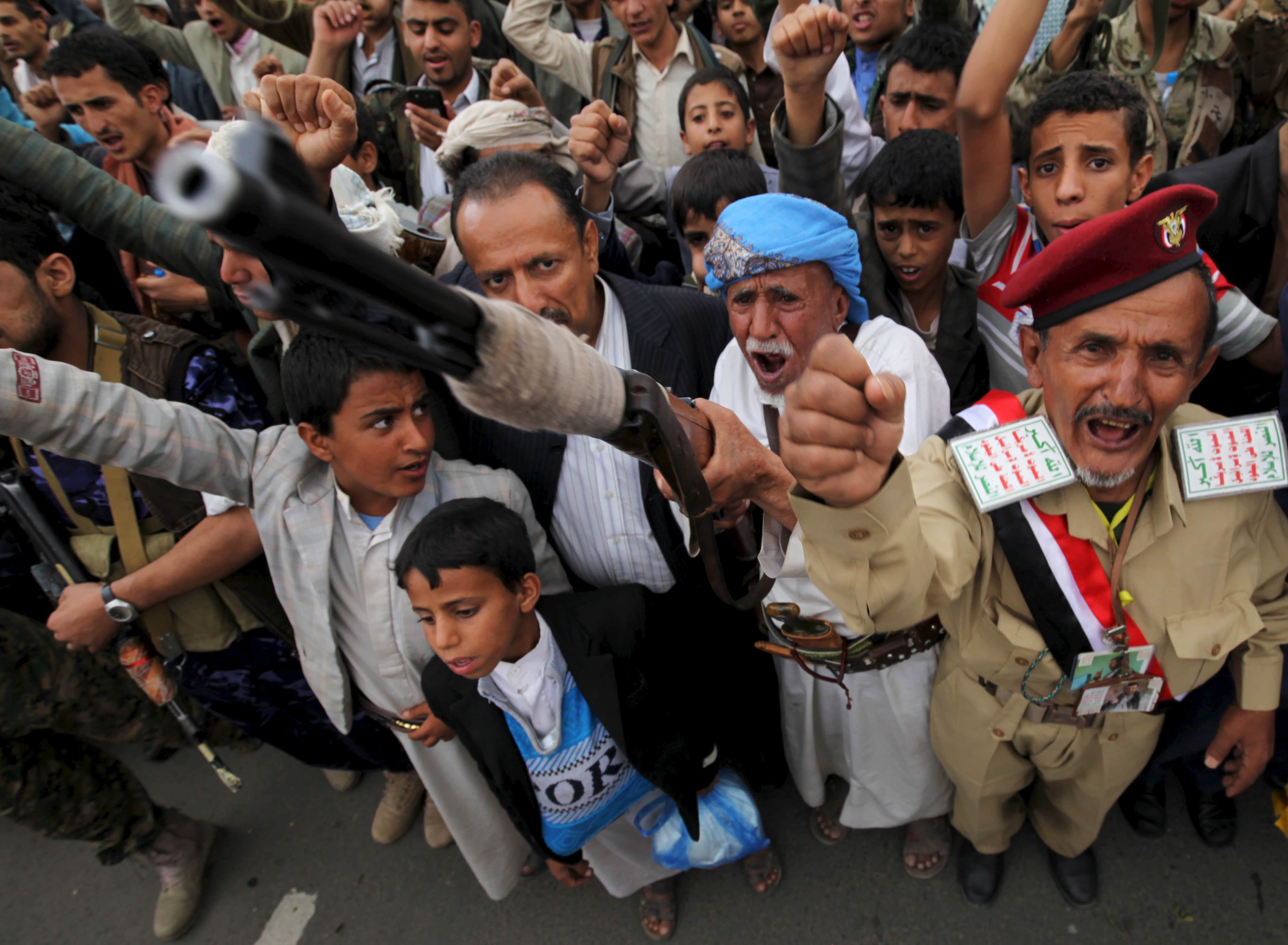 A follower of the Houthi movement raises his rifle as he shouts slogans during a rally against the Saudi-led coalition in Yemen's capital Sanaa August 11, 2015, REUTERS/Mohamed al-Sayaghi