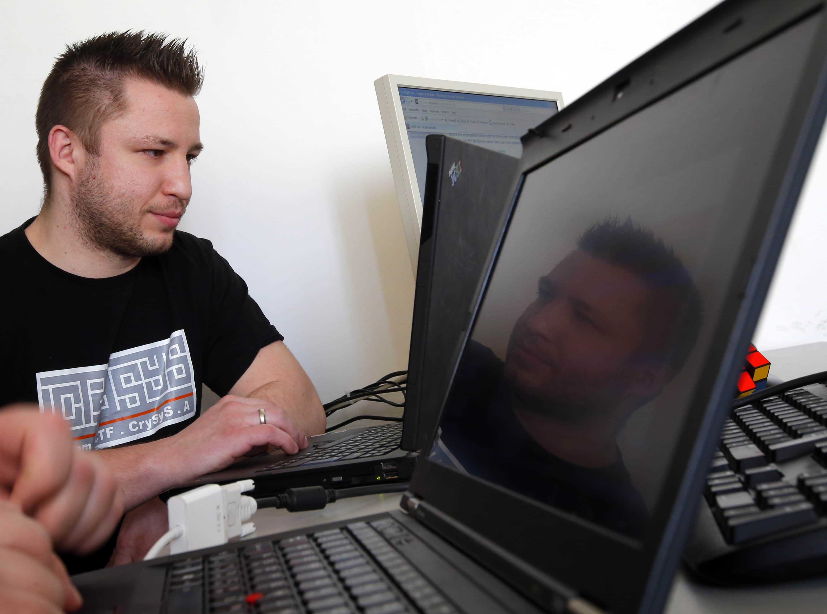 Mark Felegyhazi from Hungary's Laboratory of Cryptography and System Security, works at his computer at the Budapest Technical University, 28 February 2013, REUTERS/Laszlo Balogh