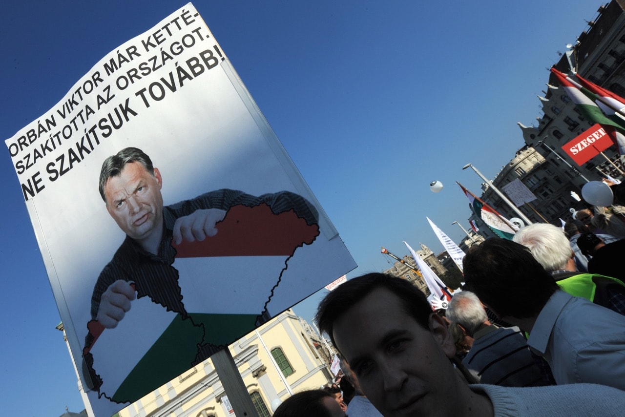During an anti-government demonstration organized by the group 'One-million citizens for press freedom', a poster reads 'Our homeland was broken by Prime Minister Viktor Orban!', in Budapest, Hungary, 23 October 2012, ATTILA KISBENEDEK/AFP/Getty Images
