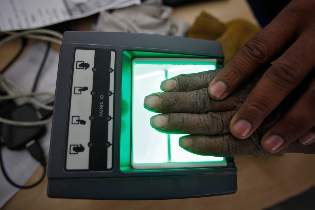 A villager has his fingerprint scanned for the Unique Identification (UID) database system, also known as Aadhaar, at an enrolment centre in the state of Rajasthan, India, 22 February 2013, REUTERS/Mansi Thapliyal