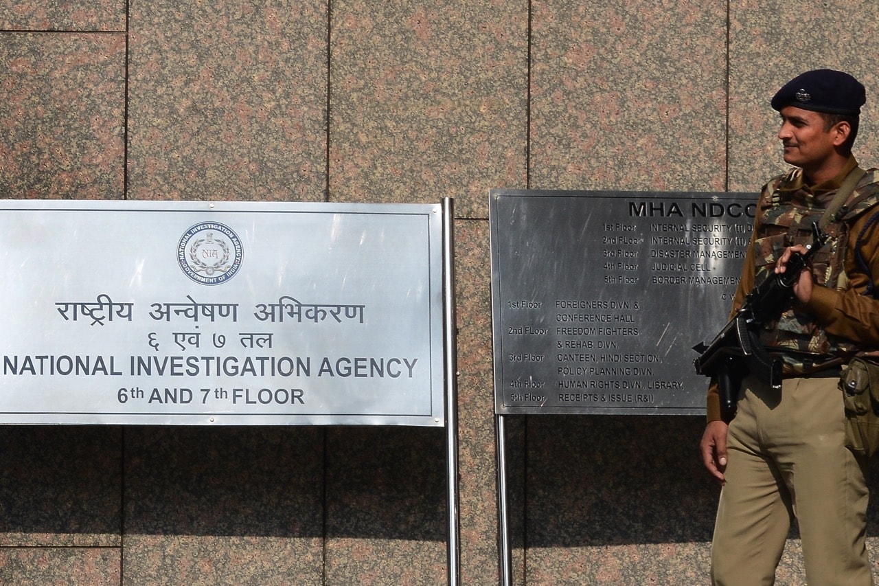 A Central Industrial Security Force guard stands outside the office of the National Investigation Agency (NIA) in New Delhi, India, 12 January 2016, MONEY SHARMA/AFP/Getty Images