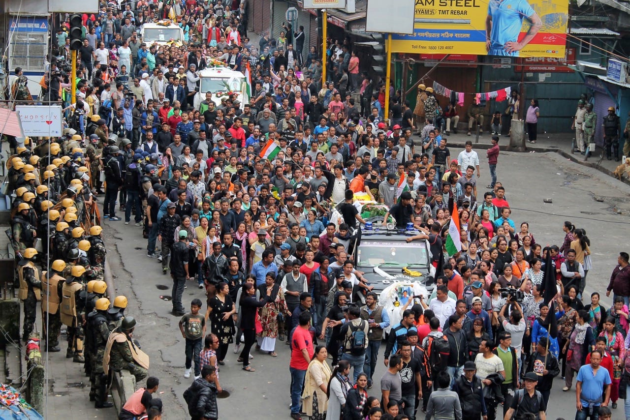 Supporters of the Gorkha Janmukti Morcha (GJM) rally as they carry bodies of protesters who were killed in clashes with security forces on Saturday, in Darjeeling, India, 18 June 2017, REUTERS/Stringer