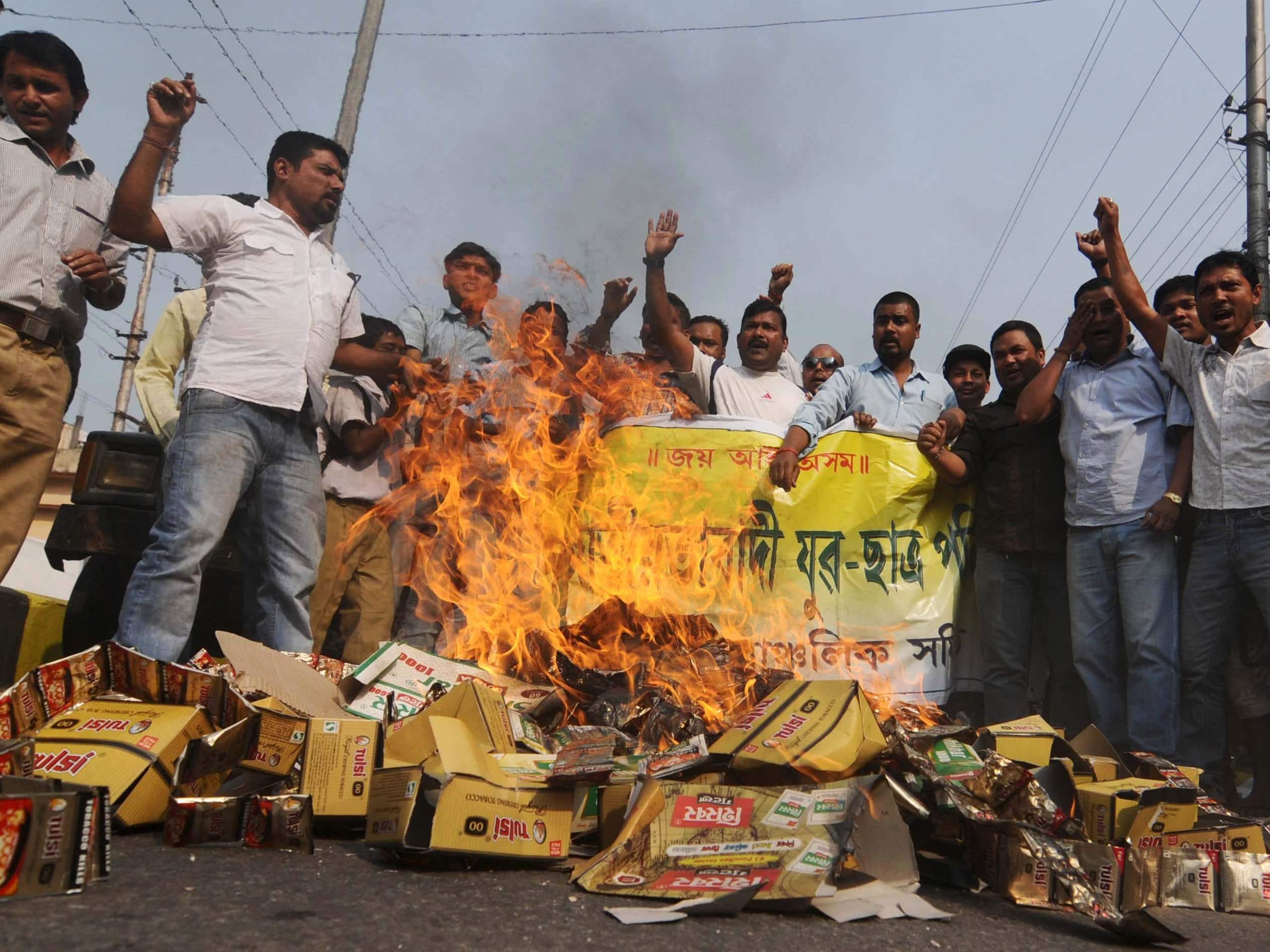 Journalist Dinesh Choudhary was attacked after reporting on illegal tobacco sales. Above, social activists burn tobacco products in Guwahati, Assam, to protest the district's failure to stop the sale of tobacco products, Demotix/Abdul Sajid