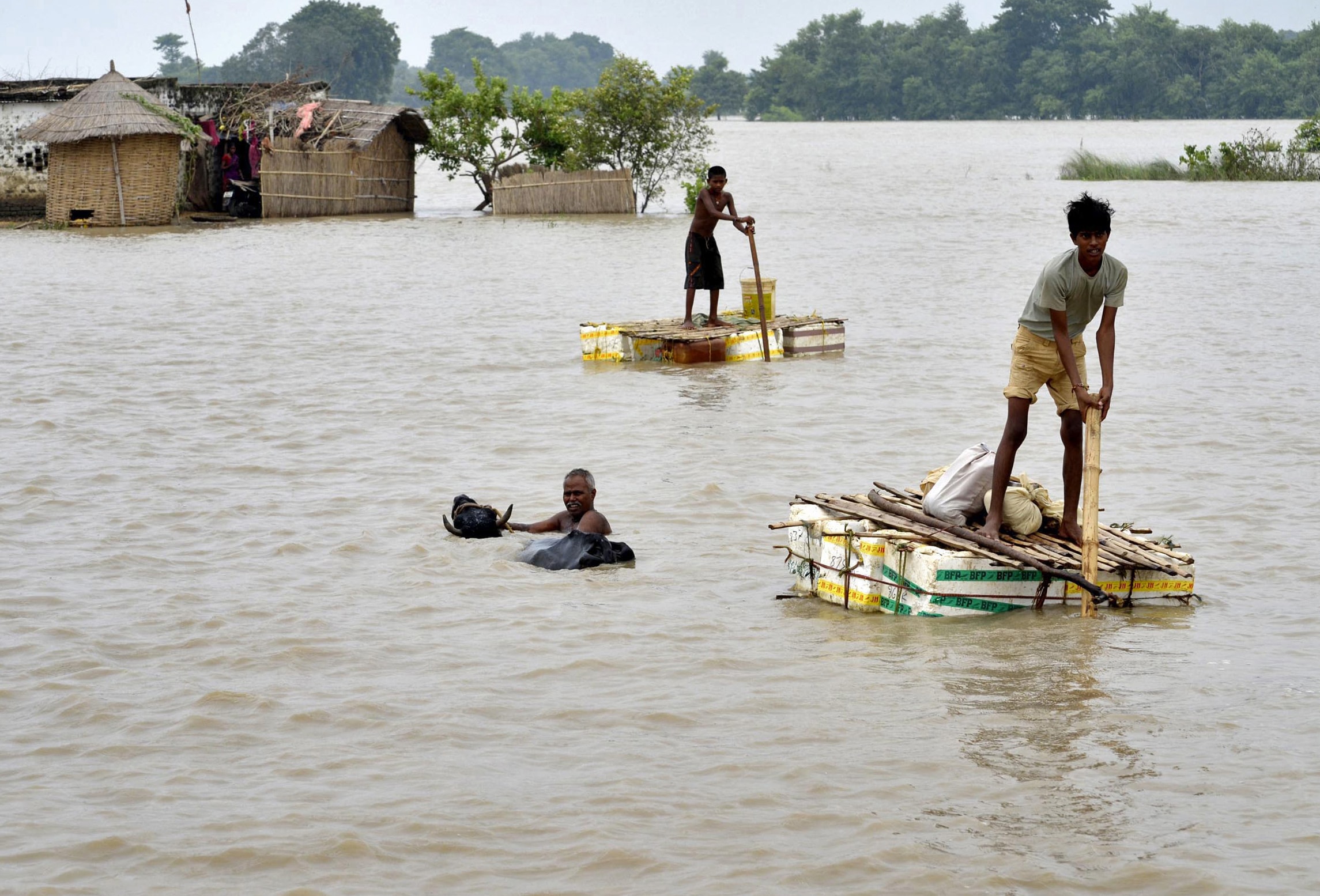 Tiwary had filed nearly 30 requests under the RTI Act to seek details about distribution of government relief for victims of a 2013 flood in Bihar; flood-affected villagers are pictured in this 29 August 2013 file photo, REUTERS/Krishna Murari Kishan