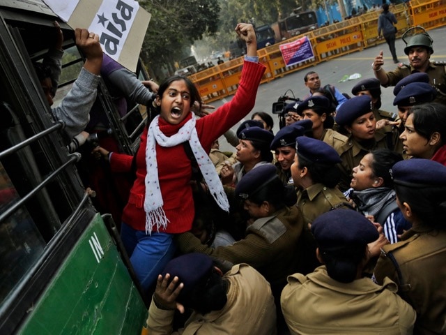 A student shouts slogans demanding the resignation of the education minister as she is detained by police during a protest against the death of student Rohith Vemula in New Delhi, India, 27 January 2016, AP Photo/Altaf Qadri