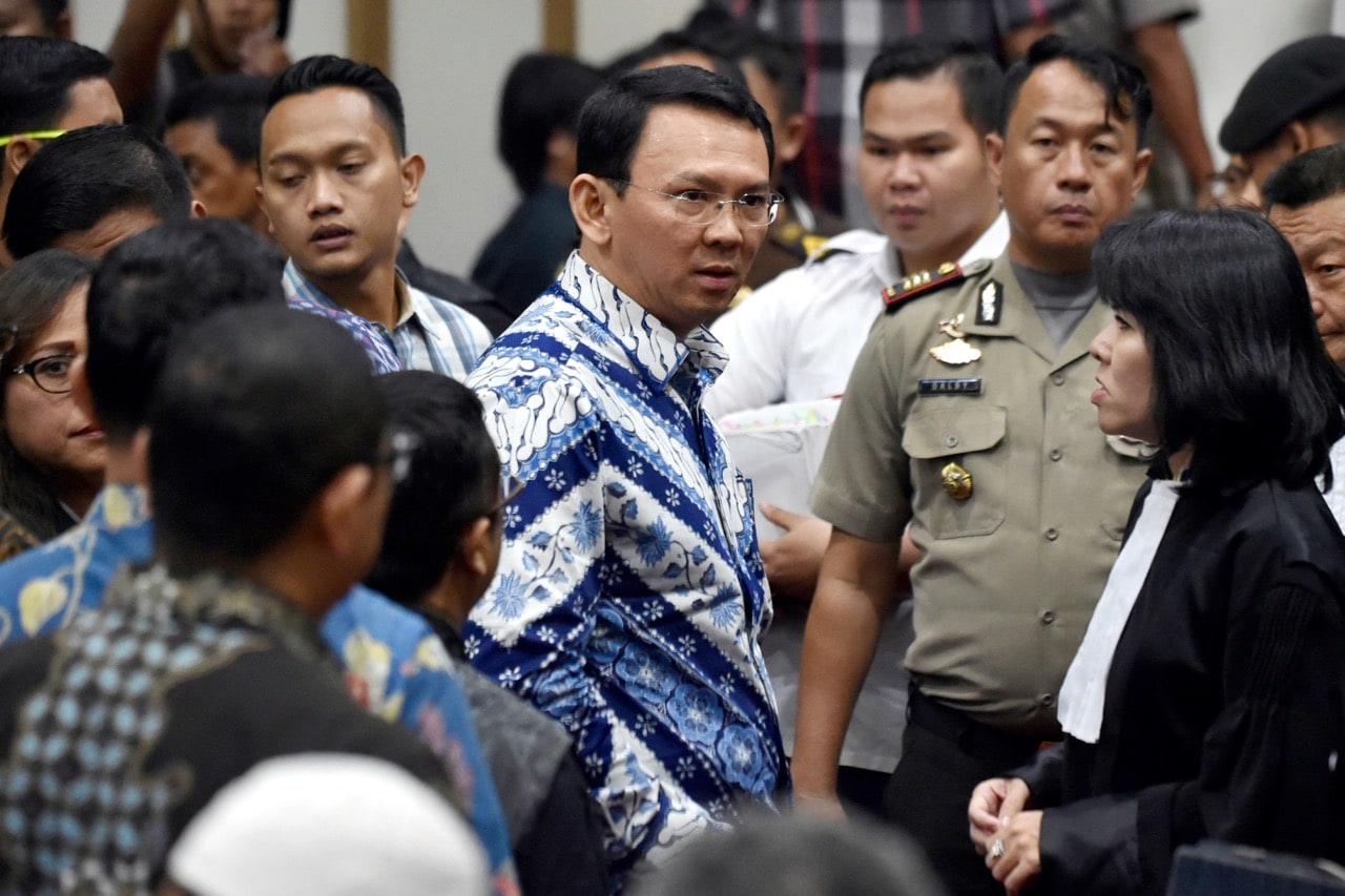 Jakarta Governor Ahok, center, talks to his lawyers after his sentencing hearing at a court in Jakarta, Indonesia, 9 May 2017, Bay Ismoyo/Pool Photo via AP