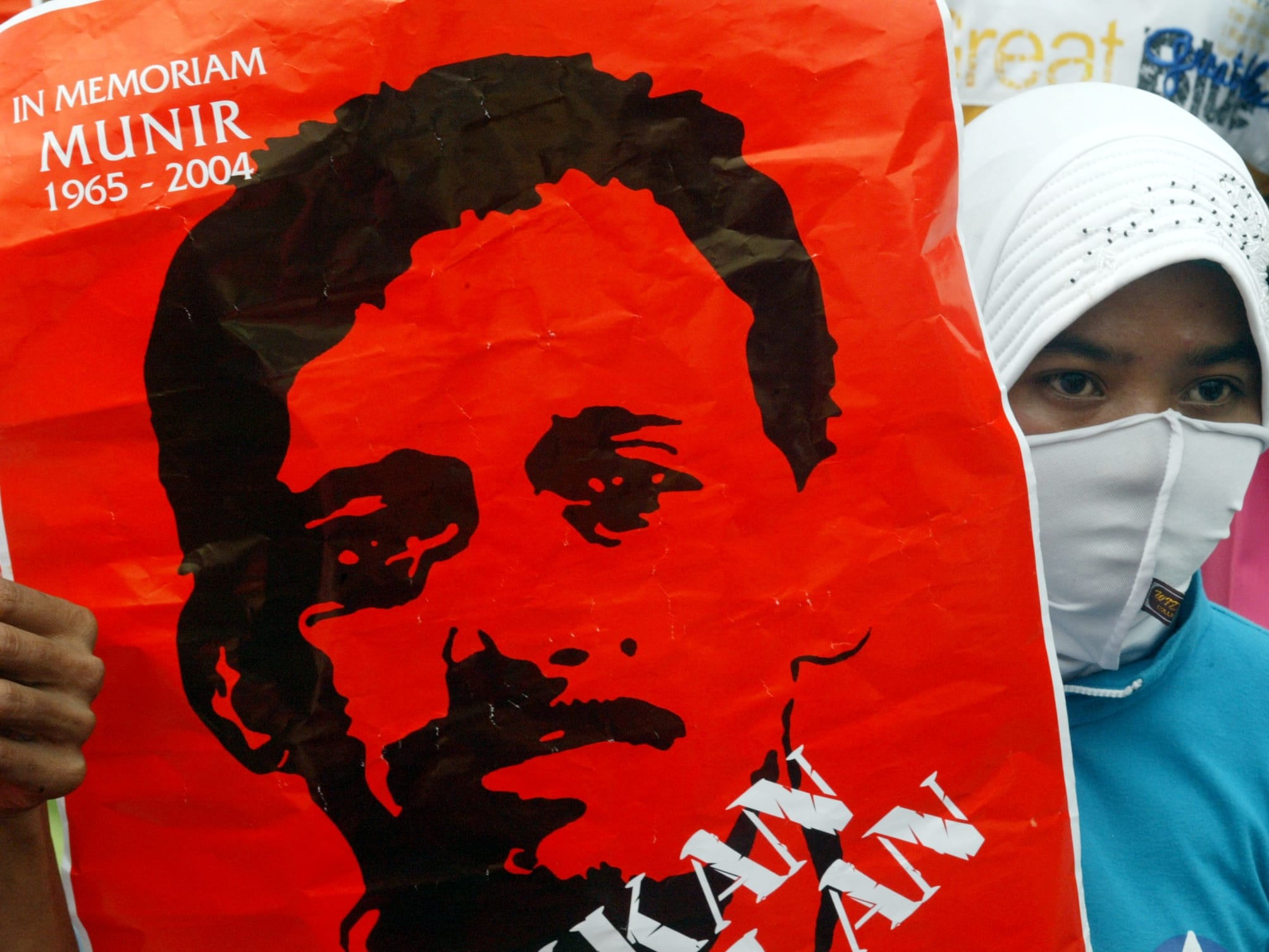 A placard depicting human rights activist Munir Thalib is displayed during a rally in front of the presidential palace in Jakarta, 8 December 2005, REUTERS/Dadang Tri