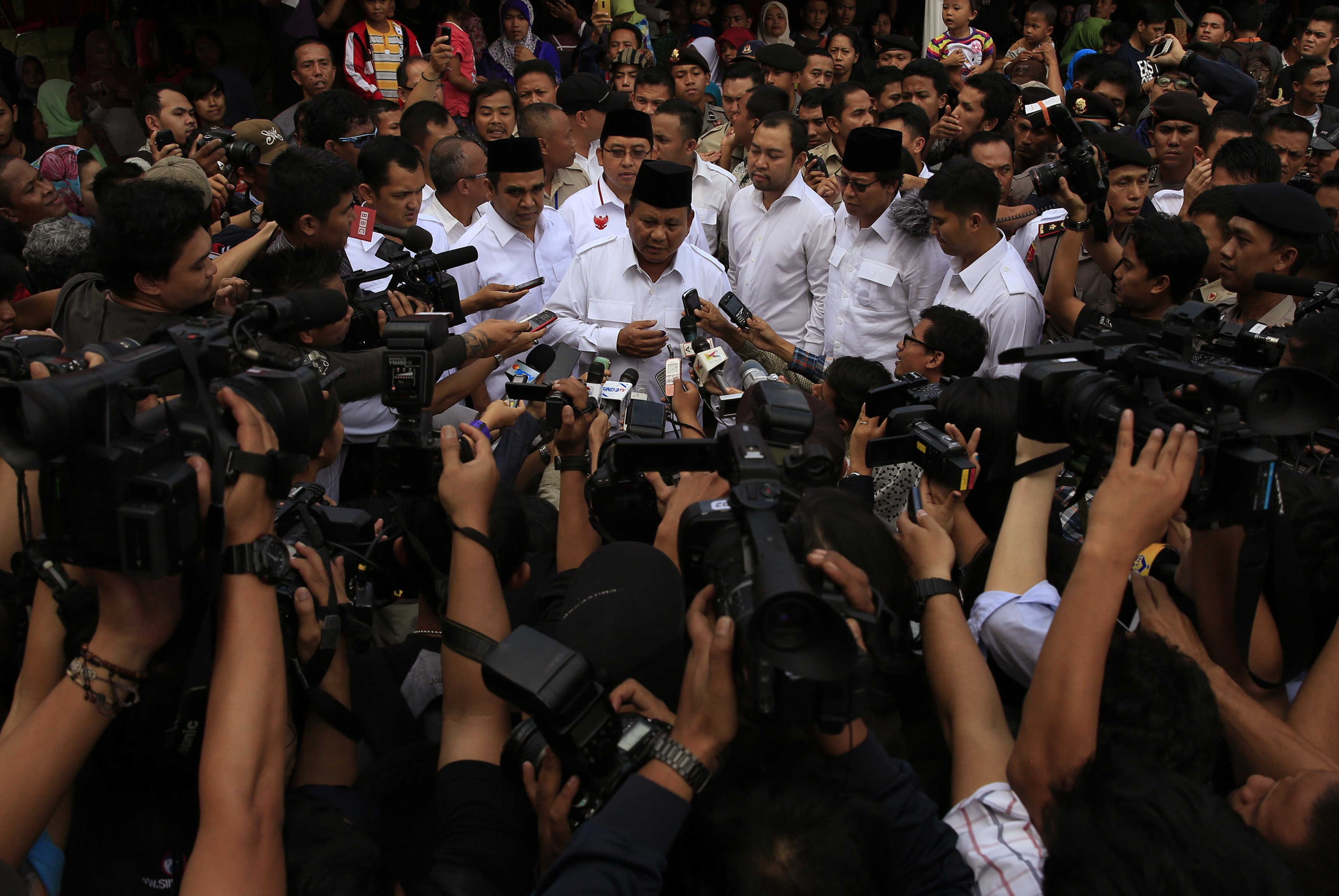 Indonesian presidential candidate Prabowo Subianto talks to reporters after voting at a polling station in Bogor, 9 July 2014, REUTERS/Beawiharta