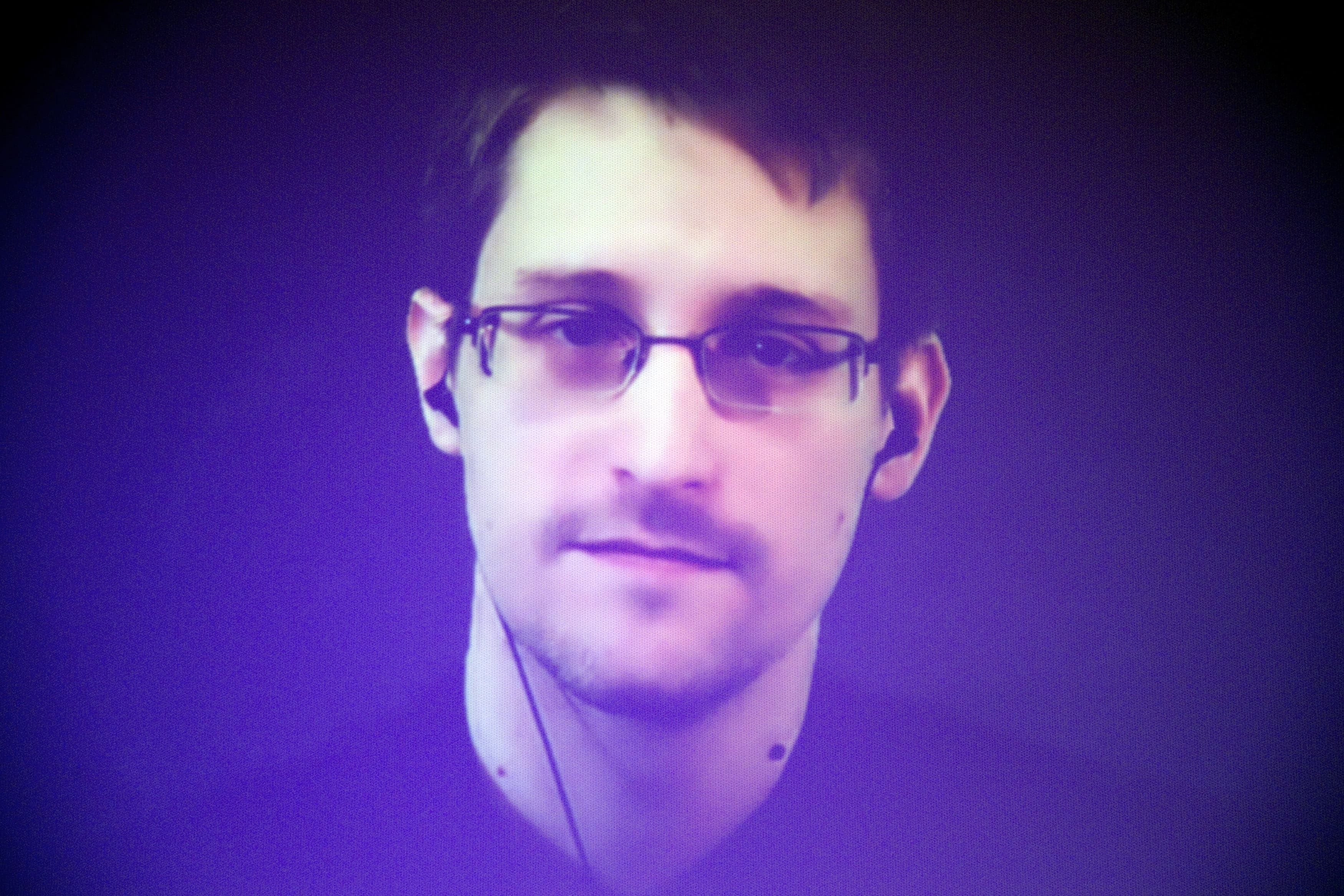 Edward Snowden is seen on a giant screen during a live video conference as part of Amnesty International's annual Write for Rights campaign at the Gaite Lyrique in Paris, France, Dec. 10, 2014, AP Photo/Charles Platiau, Pool