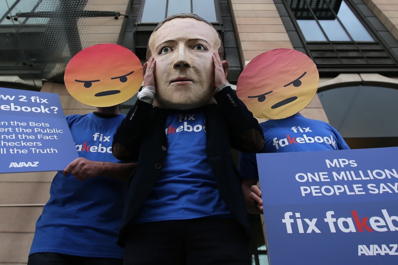 Protestors from the pressure group Avaaz demonstrate outside Portcullis house where Facebook's Chief Technology Officer Mike Schroepfer was to be questioned by members of parliament in London, UK, 26 April 2018, DANIEL LEAL-OLIVAS/AFP/Getty Images