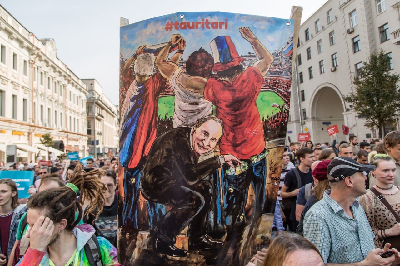 A painting with Putin is seen during the protest against the planned increase in pension age nationwide in Moscow, Russia, 9 September 2018; Google reportedly caved in to pressure from Russian authorities and took down videos promoting the rally, Victor Kruchinin/SOPA Images/LightRocket via Getty Images