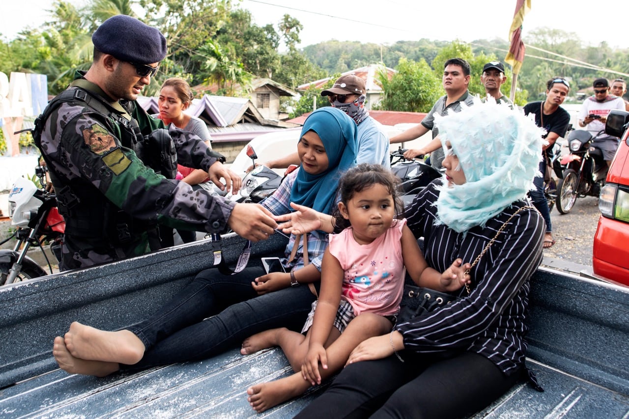 Security forces check identification at a checkpoint in Cotabato on the island of Mindanao, Philippines, 20 January 2019, NOEL CELIS/AFP/Getty Images