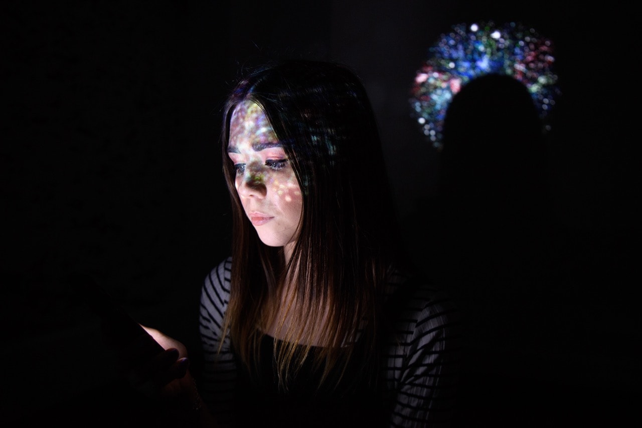 In this photo illustration, a virtual map of the internet is projected onto a woman in London, England, 9 August 2017, Leon Neal/Getty Images