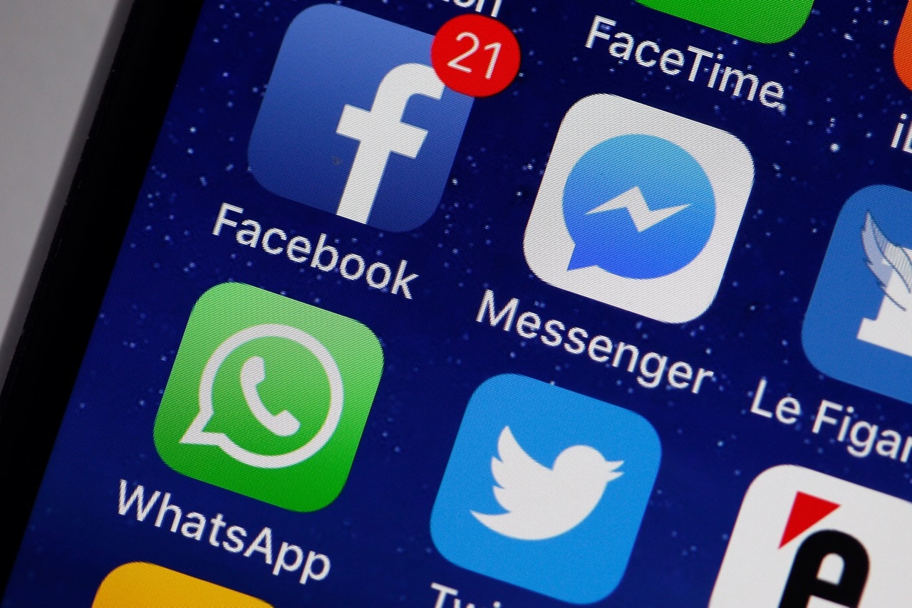 The logo of the Facebook, Messenger, Whatsapp and Twitter applications are displayed on the screen of an Apple iPhone in Paris, France, 6 April 2018, Photo Illustration by Chesnot/Getty Images