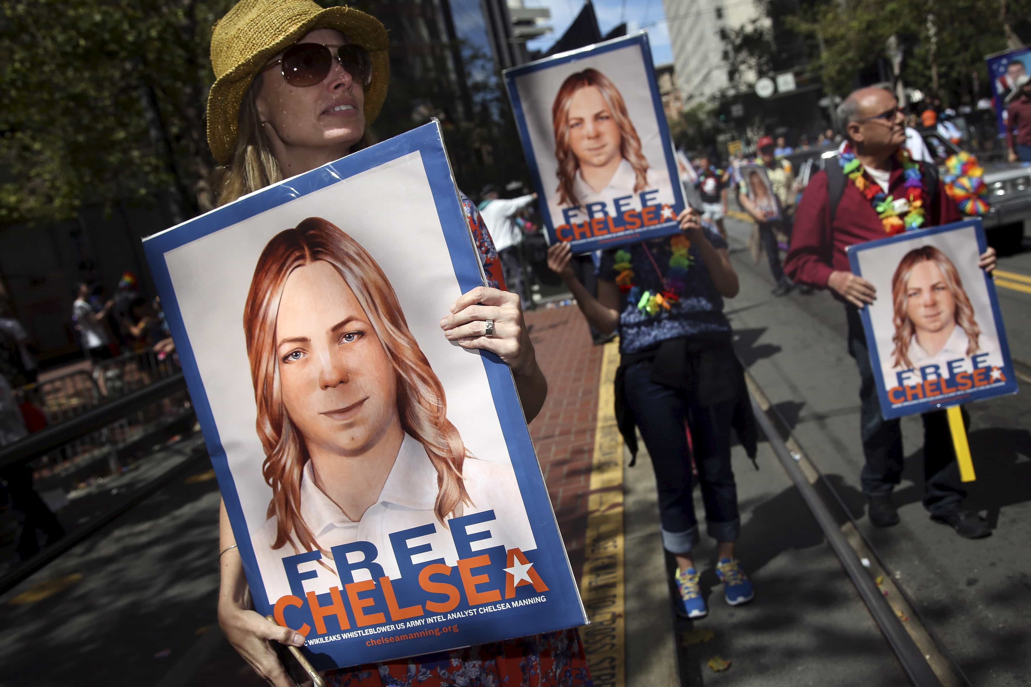 People hold signs calling for the release of imprisoned wikileaks whistleblower Chelsea Manning while marching in a gay pride parade in San Francisco, California, 28 June 2015, REUTERS/Elijah Nouvelage