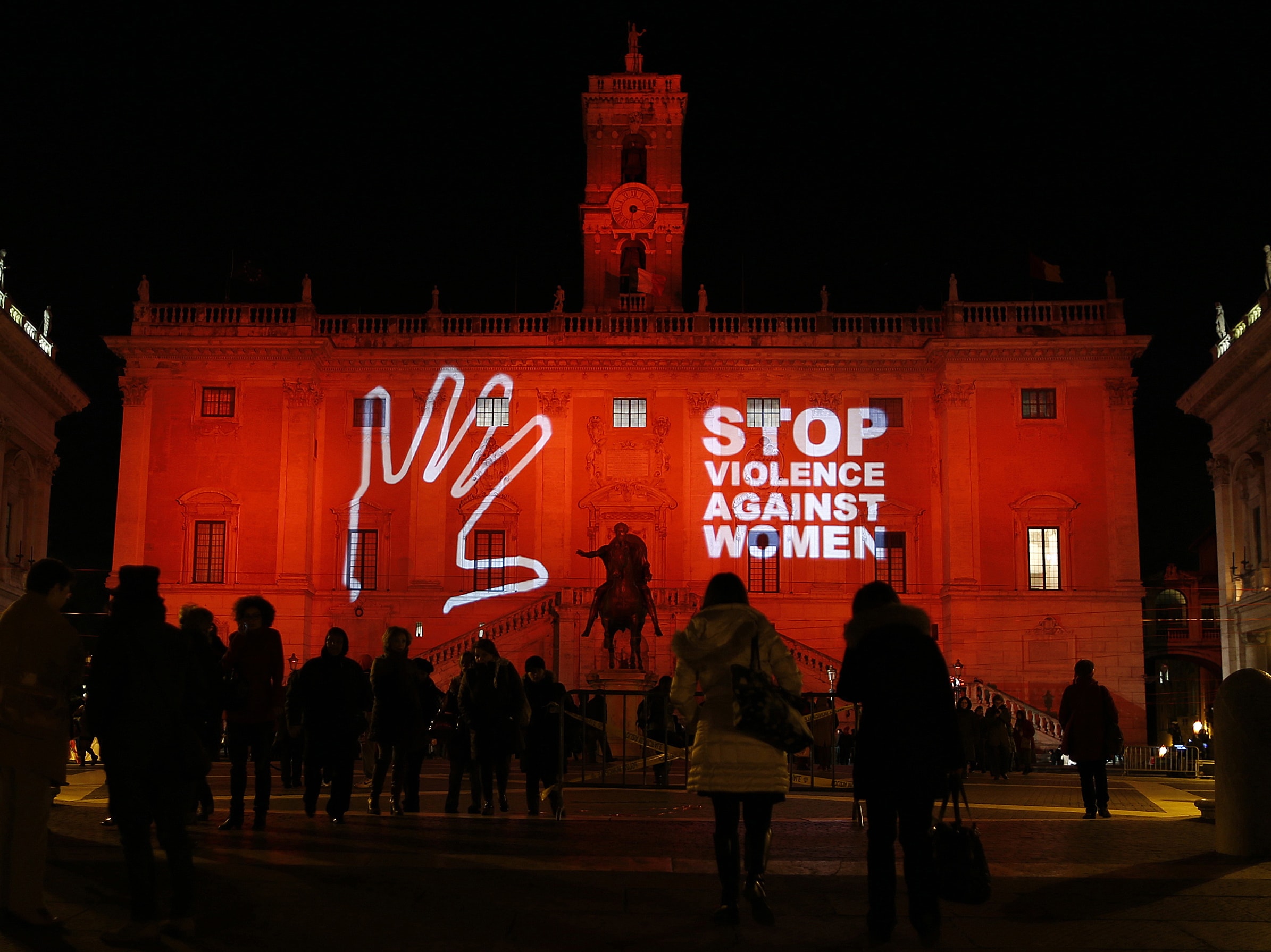 A message is projected at Rome's Campidoglio palace, as part of International Day for the Elimination of Violence Against Women, 25 November 2013, REUTERS/Alessandro Bianchi