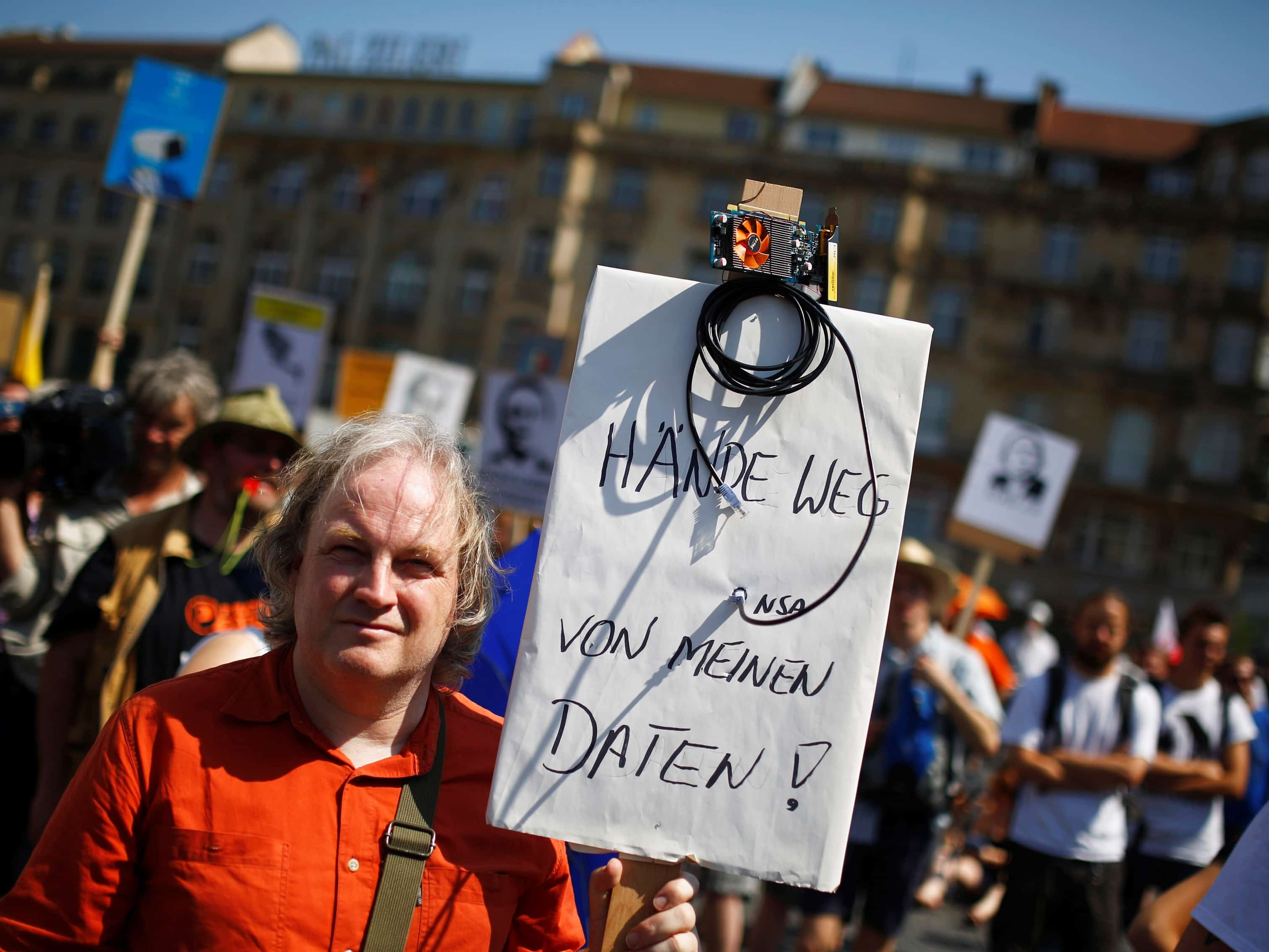 A protester holds a placard which reads "Hands off my data" during a demonstration in Frankfurt, Germany, 27 July 2013, REUTERS/ Kai Pfaffenbach