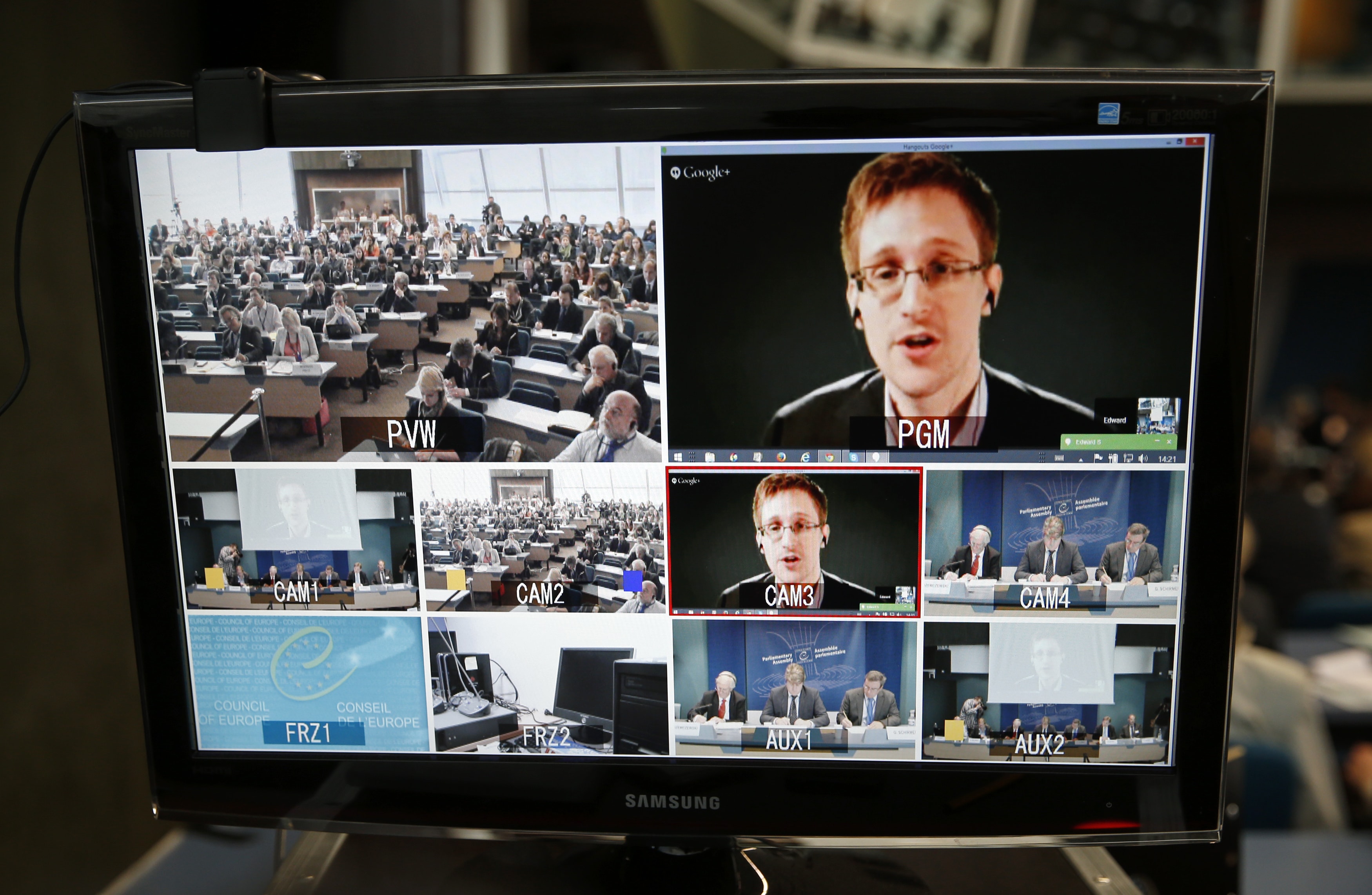 Accused government whistleblower Edward Snowden is seen on a screen as he speaks via video conference with members of the Committee on legal Affairs and Human Rights of the Parliamentary Assembly of the Council of Europe during a hearing on "mass surveillance" at the Council of Europe in Strasbourg, 8 April 2014, REUTERS/Vincent Kessler