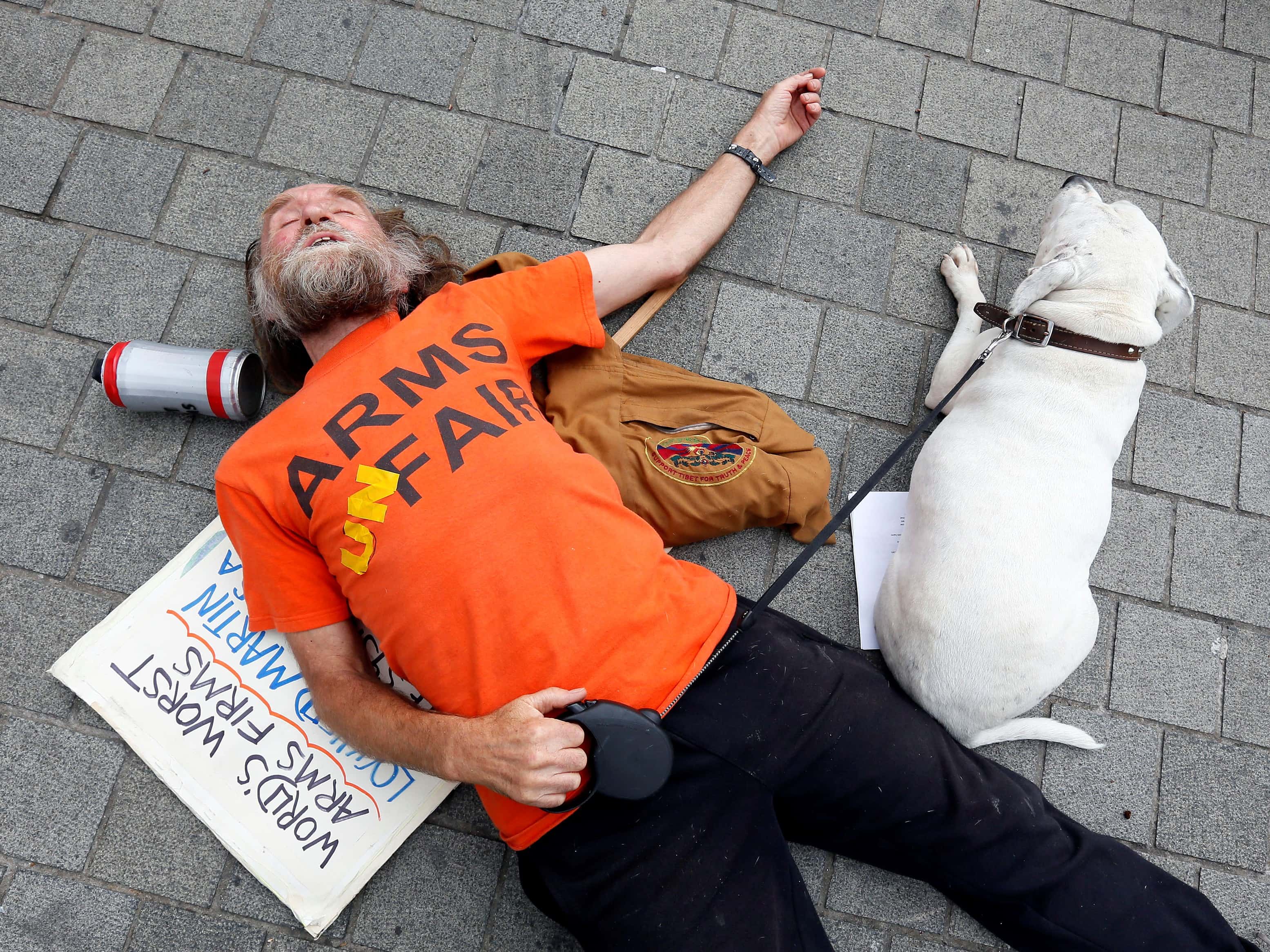 A protester takes part in a demonstration outside the Houses of Parliament in London against the Defence Security Equipment International (DSEI) arms fair, 12 September 2013, REUTERS/Stefan Wermuth