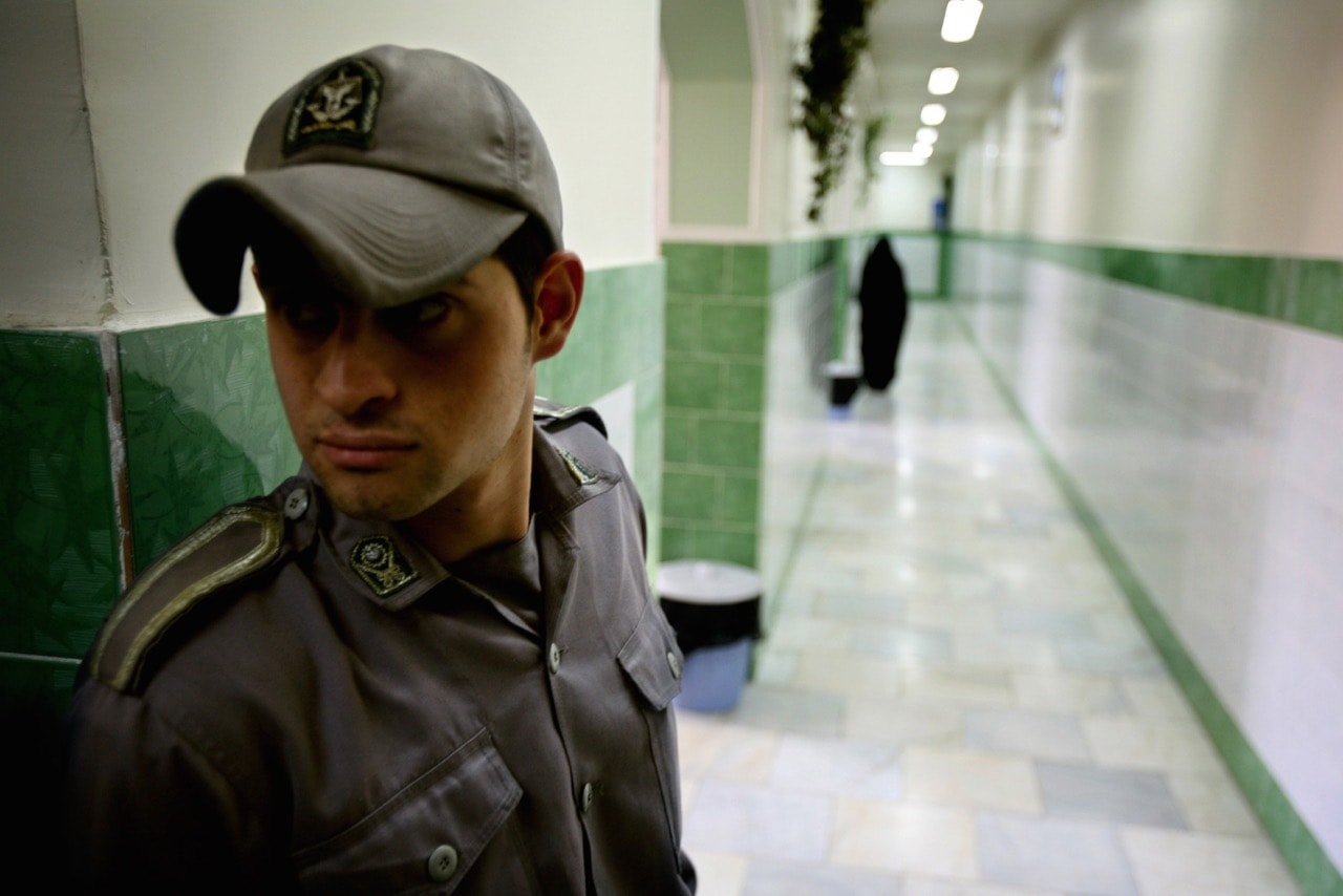 A prison guard stands along a corridor in Tehran's Evin prison, 13 June 2006, REUTERS