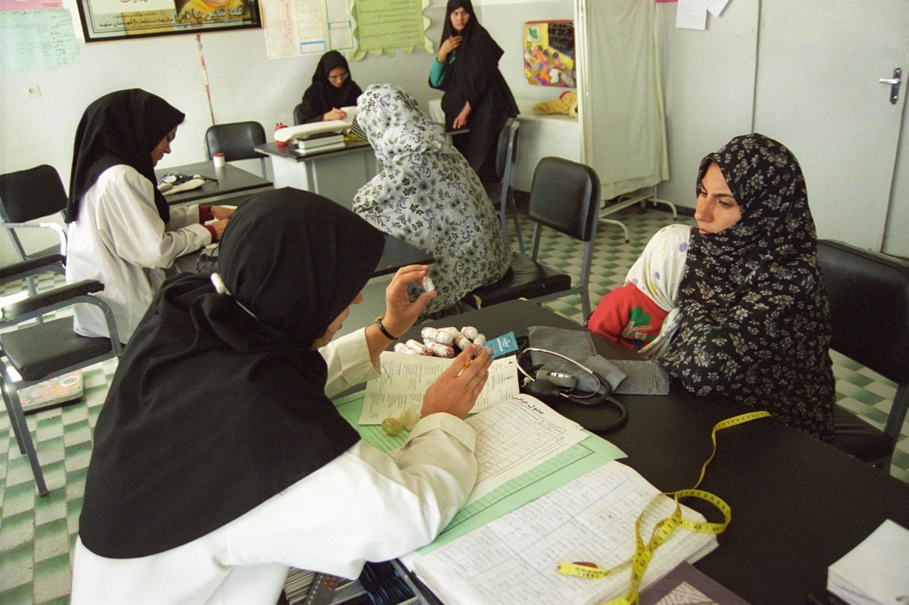 An Afghan refugee is given an introduction to contraception by an Iranian nurse in the family planning department of a Medecins Sans Frontieres clinic, Golshahr district of Mashad, north east Iran, 23 February 1999, Kaveh Kazemi/Getty Images
