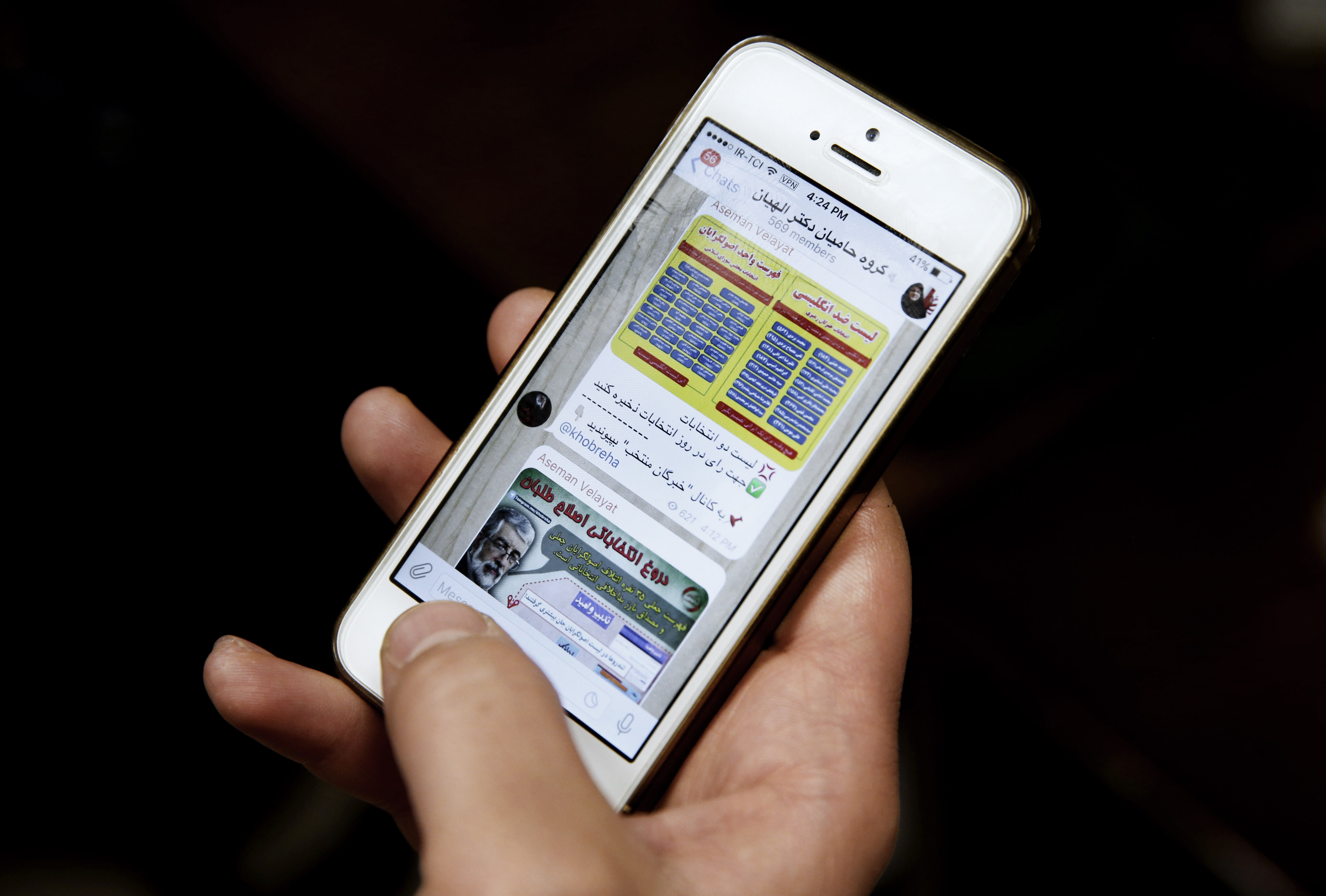 An Iranian man shows Telegram app messages from supporters of female conservative candidate Zohreh Elahian, on his mobile phone in Tehran, 24 February 2016, AP Photo/Vahid Salemi