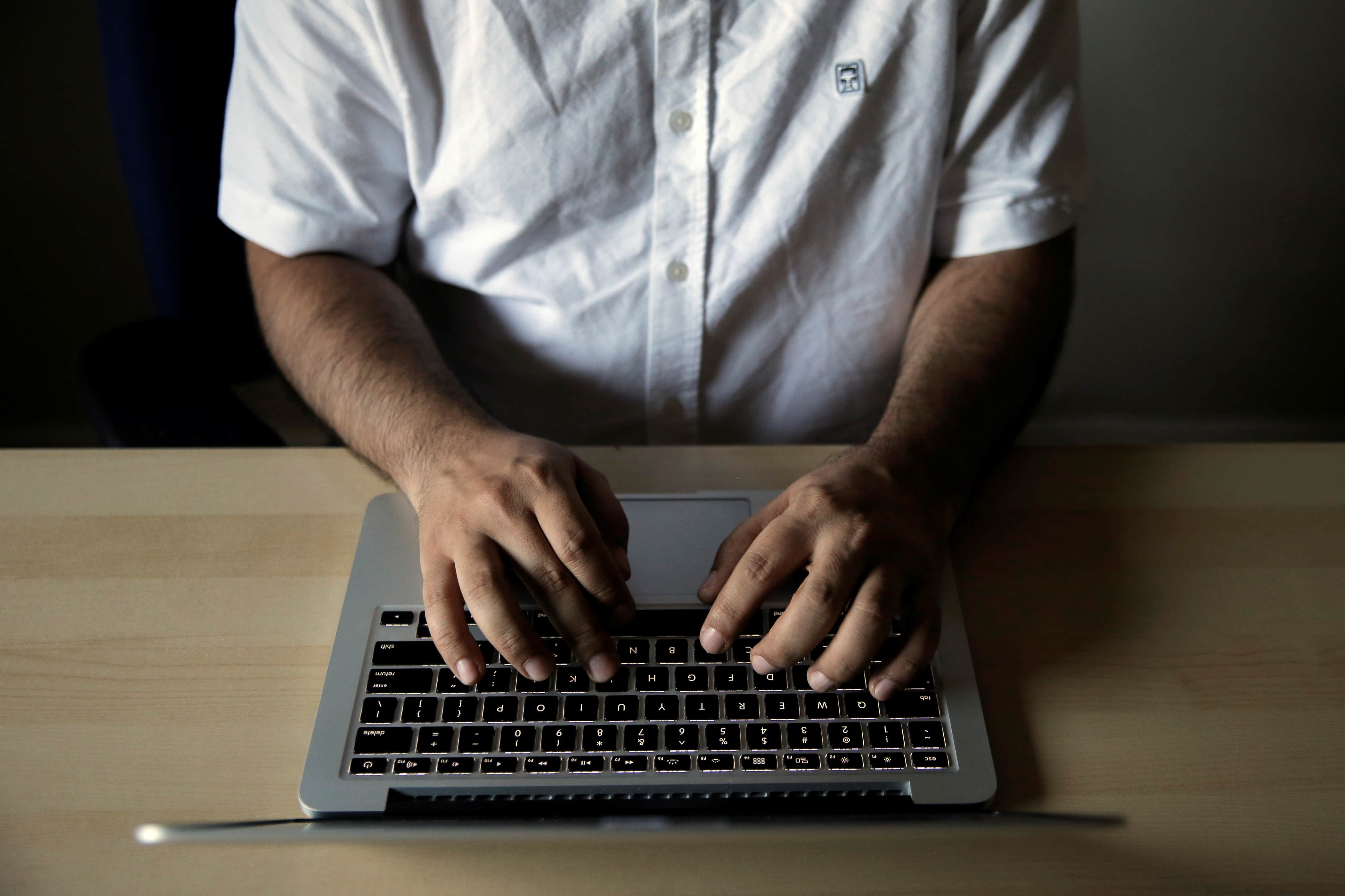 Amir Rashidi, an Internet security researcher who has worked with Telegram users who were victims of hacking, works at the offices of International Campaign for Human Rights in Iran, in the US, July 27, 2016, REUTERS/Brendan McDermid