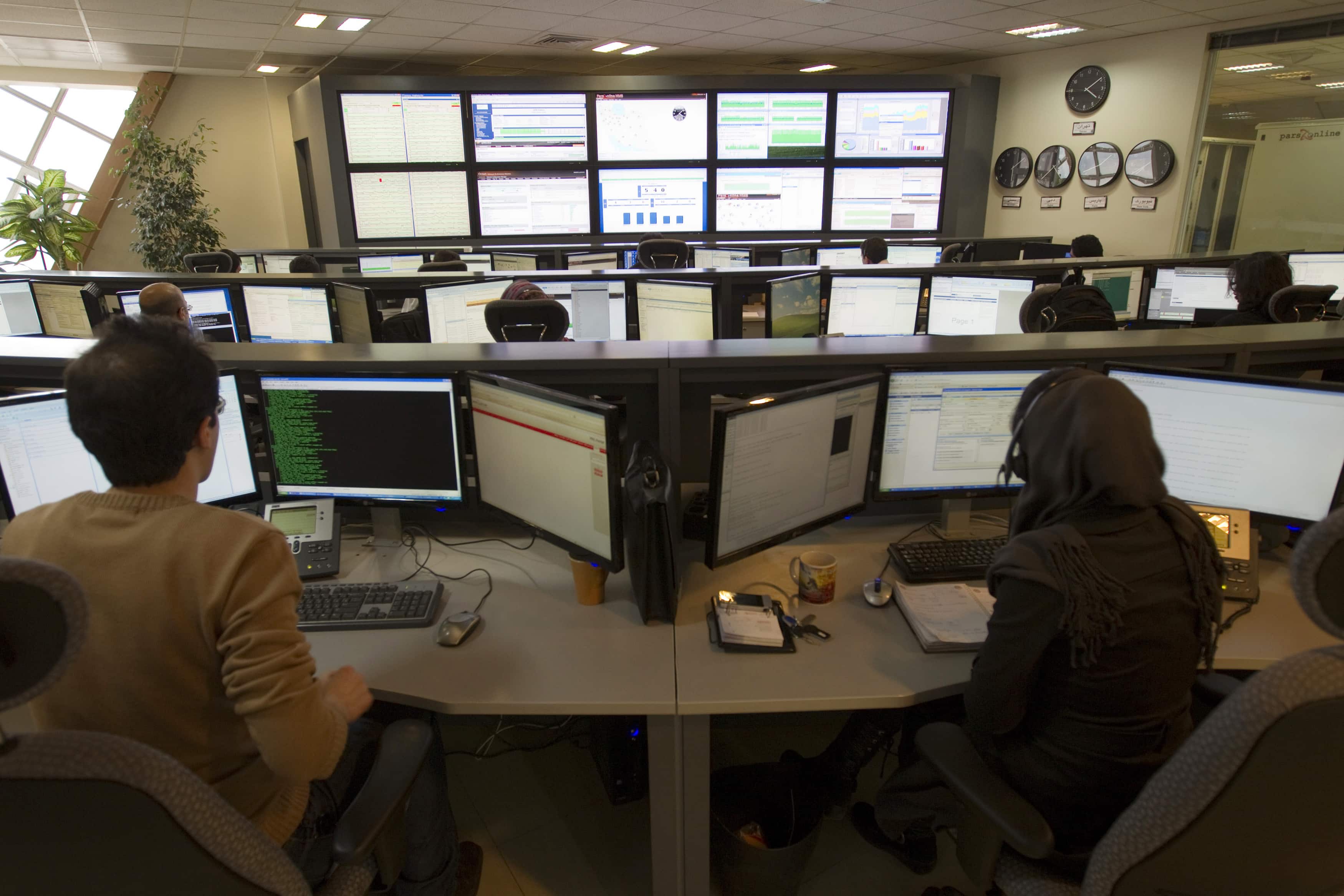 Technicians monitor data flow in the control room of an internet service provider in Tehran February 15, 2011, REUTERS/Caren Firouz