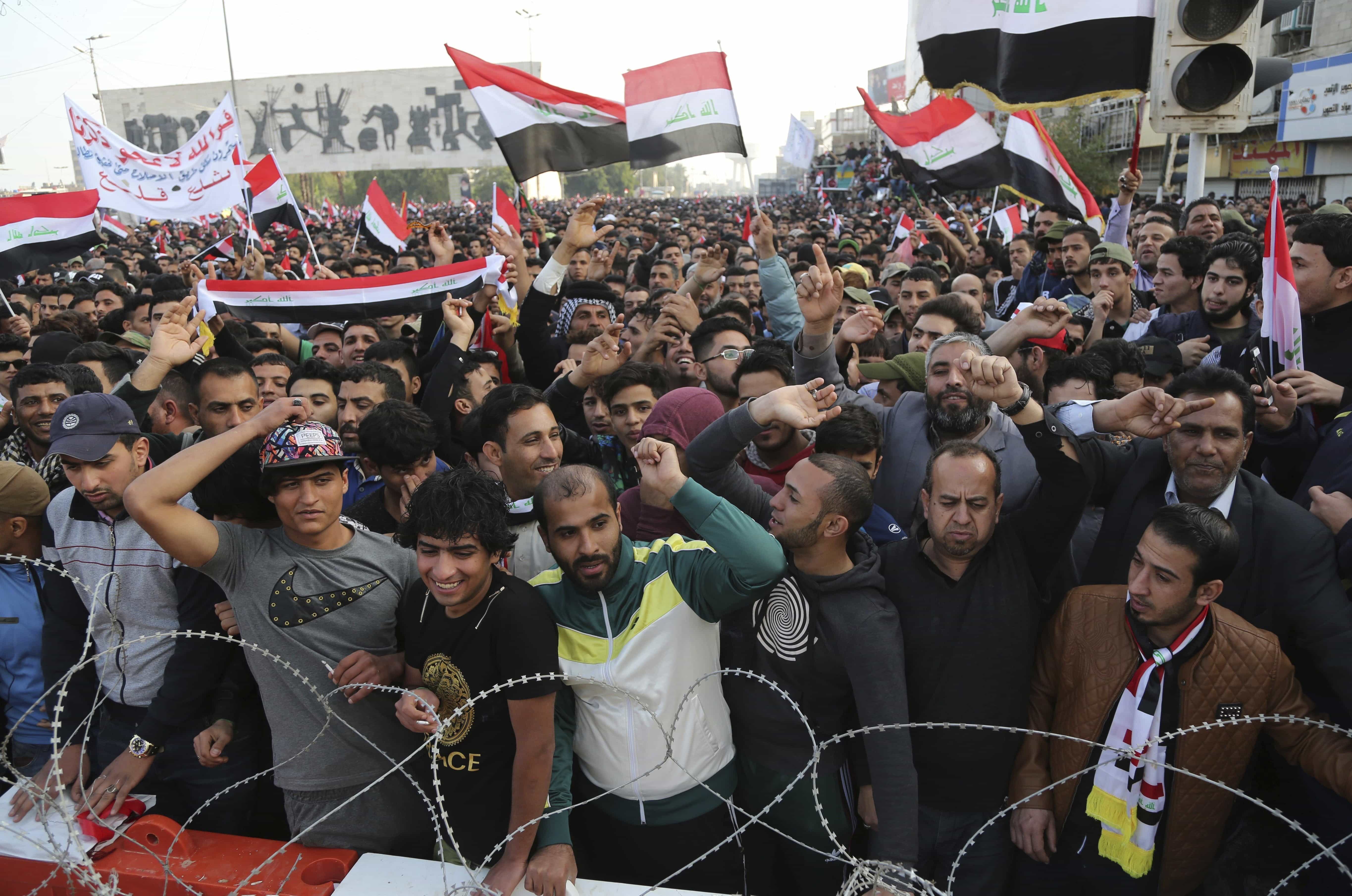 Followers of Shiite cleric Muqtada al-Sadr chant slogans demanding government reform during a demonstration in Tahrir square, Baghdad, Iraq, 24 March 2017, AP Photo/Karim Kadim