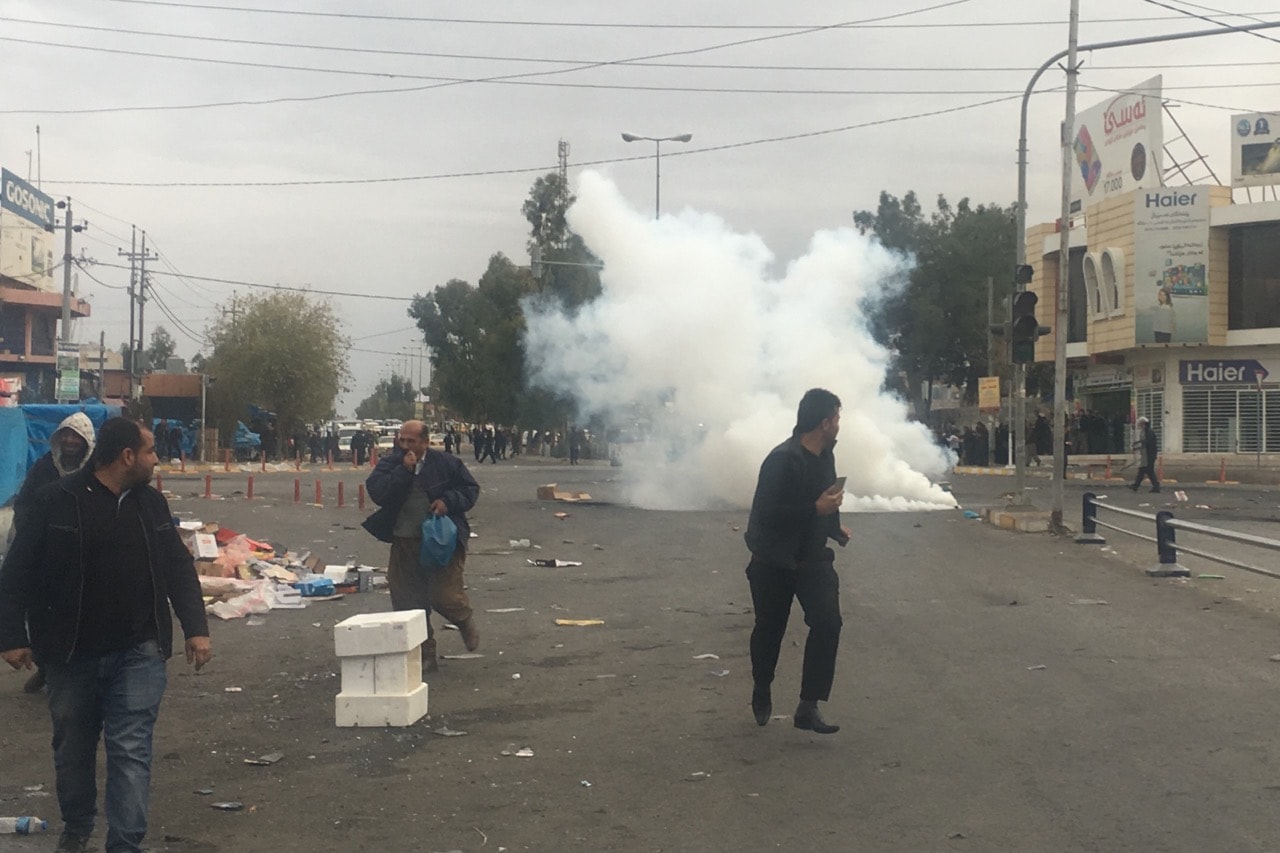 Tear gas is fired during anti-government protests in Sulaymaniyah, Iraq, 19 December 2017, Feriq Ferec/Anadolu Agency/Getty Images