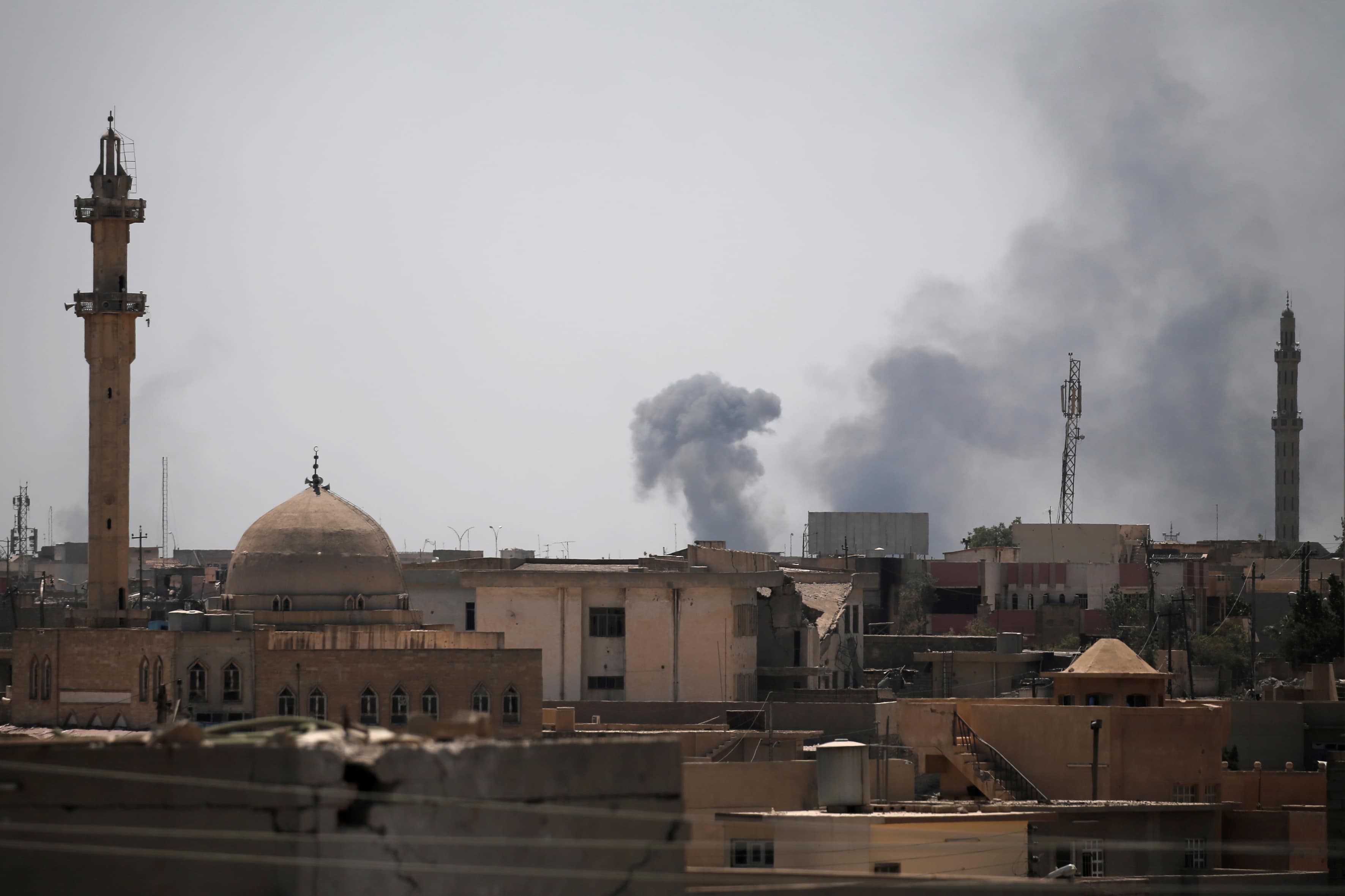 Smoke billows from the positions of the Islamic State militants after an artillery attack by the Iraqi forces in western Mosul, 19 June 2017 , REUTERS/Alkis Konstantinidis