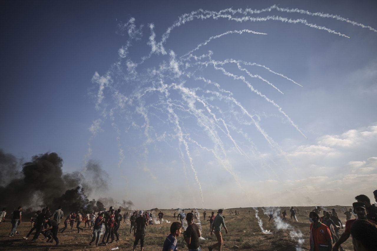 Israeli security forces use tear gas to disperse Palestinian protestors on the 21st Friday of the 'Great March of Return' demonstration, in Gaza, 17 August 2018, Ali Jadallah/Anadolu Agency/Getty Images