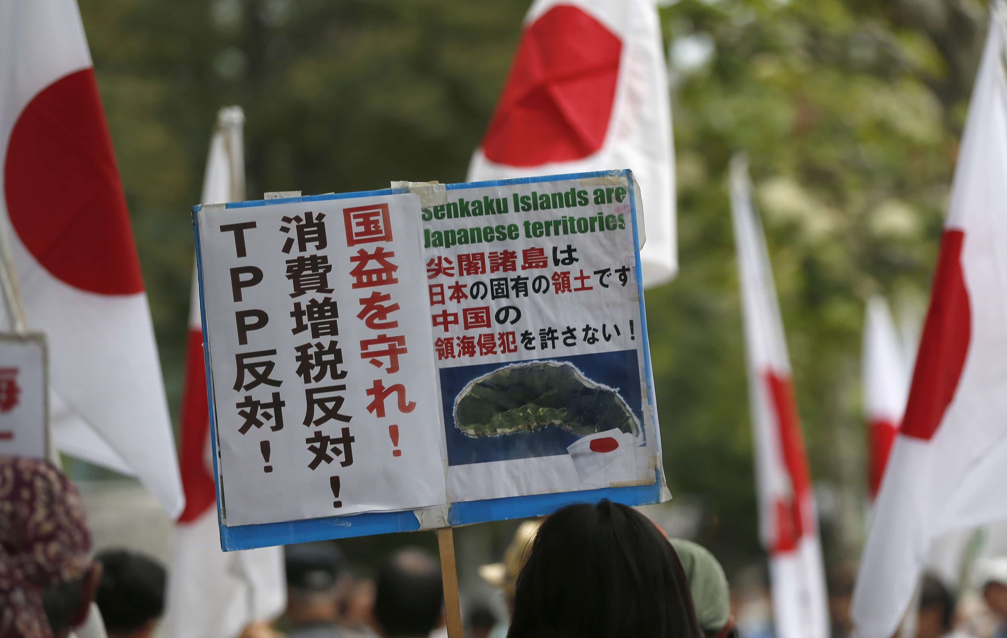 A placard displayed during a rally in Tokyo partly reads, "No TPP (Trans-Pacific Partnership), Protect our national interest", 11 September 2013, REUTERS/Toru Hanai