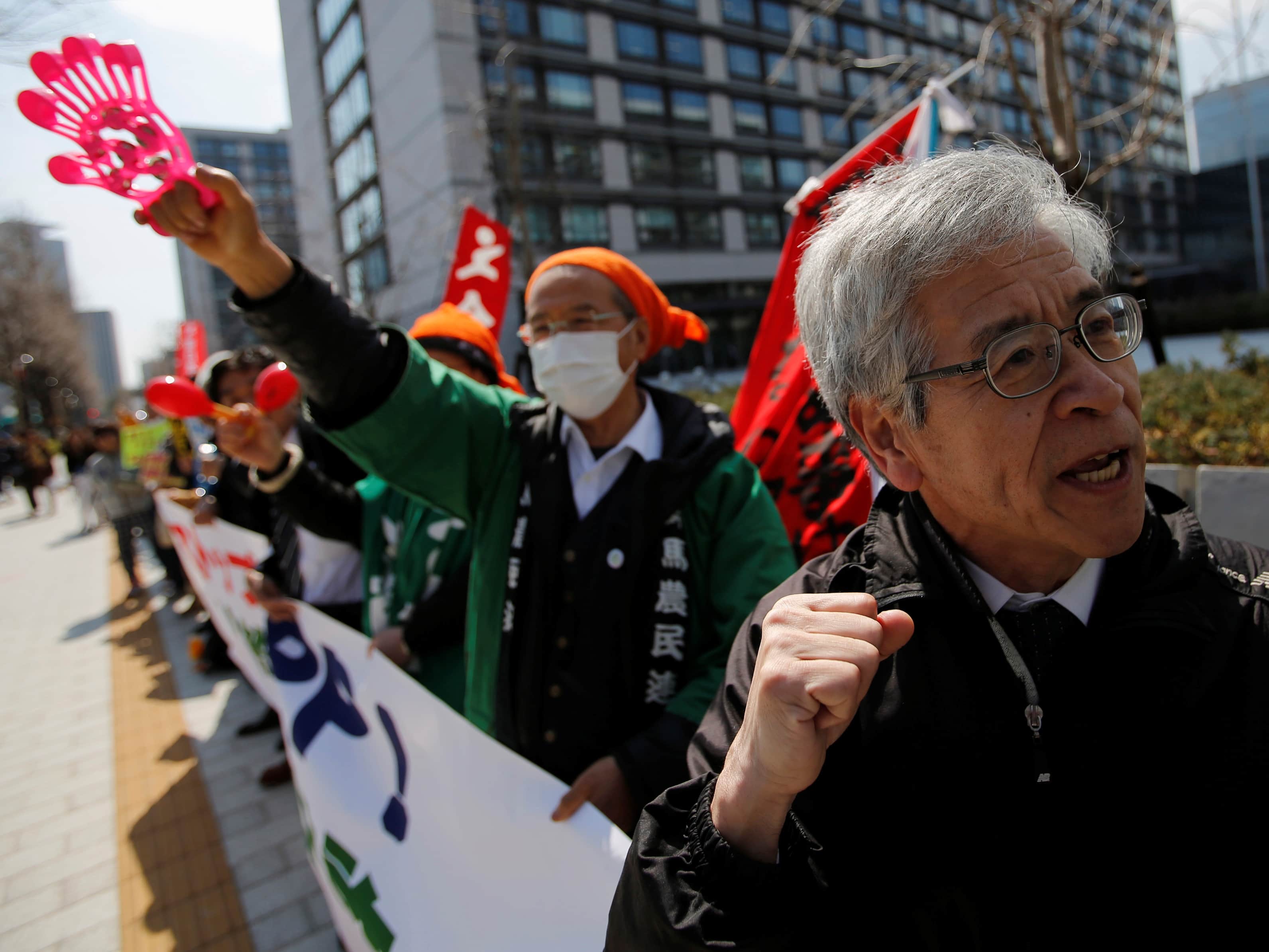 Protesters at a rally against Japan participating in rule-making negotiations for the Trans-Pacific Partnership (TPP) in front of the parliament in Tokyo, 15 March 2013, REUTERS/Issei Kato