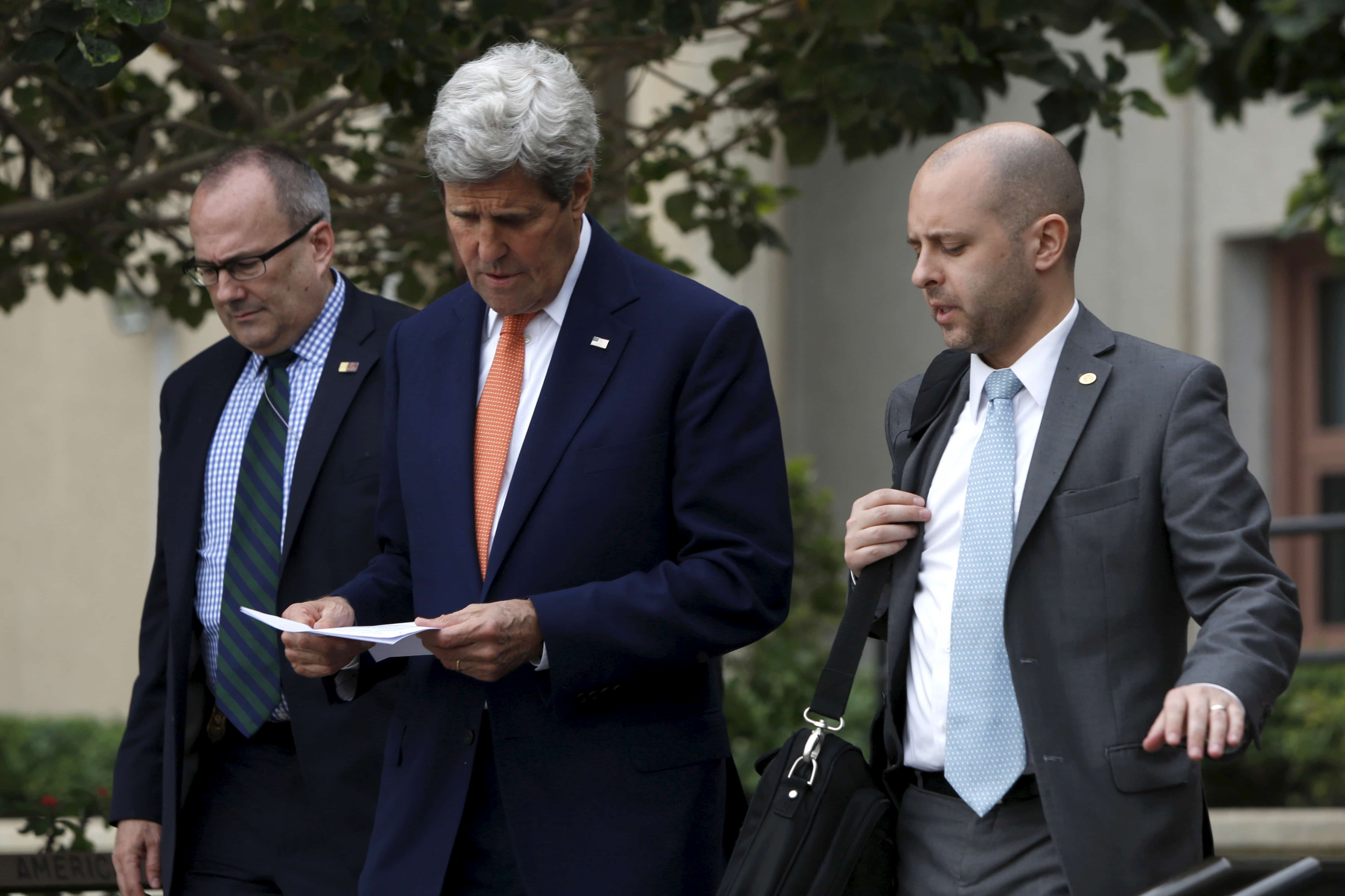 U.S. Secretary of State John Kerry walks with staff as he departs the U.S. Embassy in Manama, Bahrain April 7, 2016, REUTERS/Jonathan Ernst