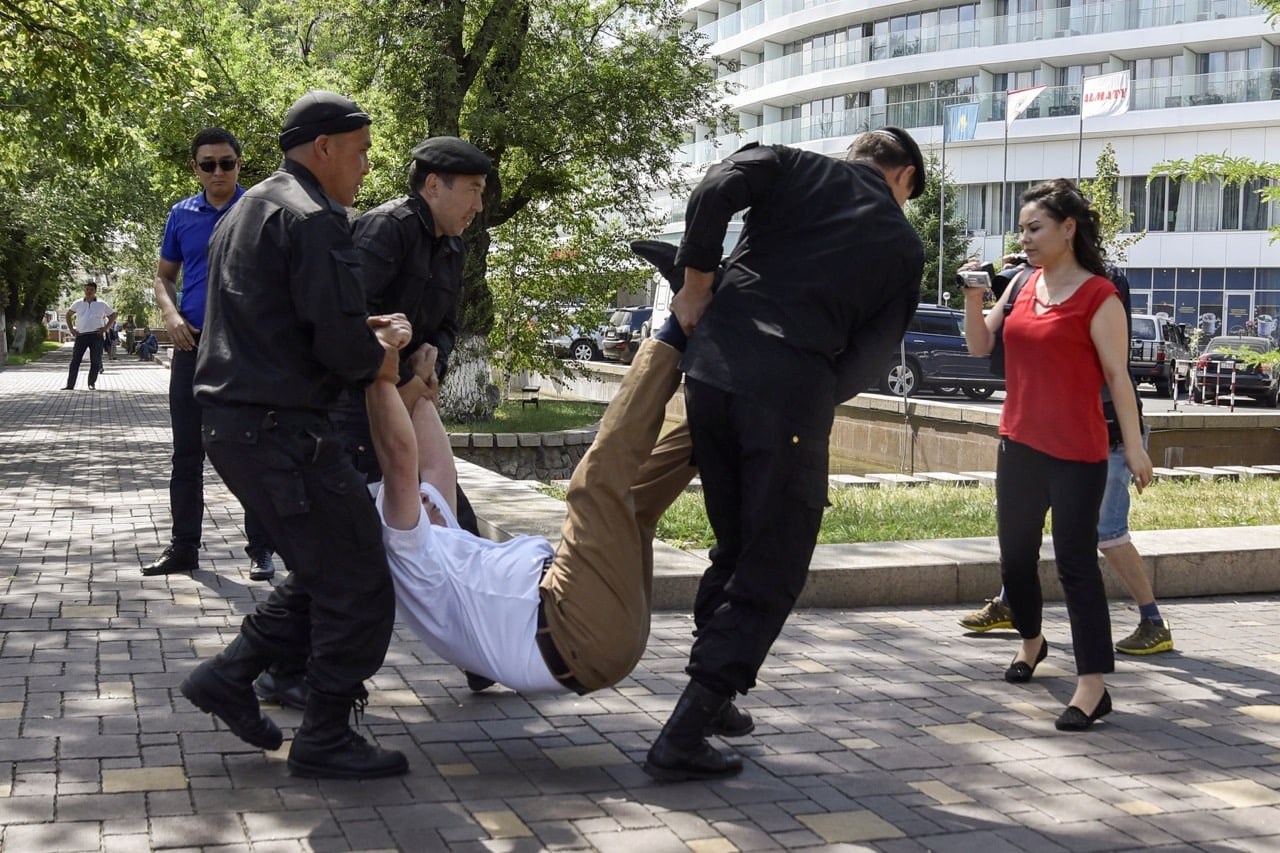 Police officers detain an opposition supporter attempting to stage a protest rally in Almaty, Kazakhstan, 23 June 2018, REUTERS/Mariya Gordeyeva